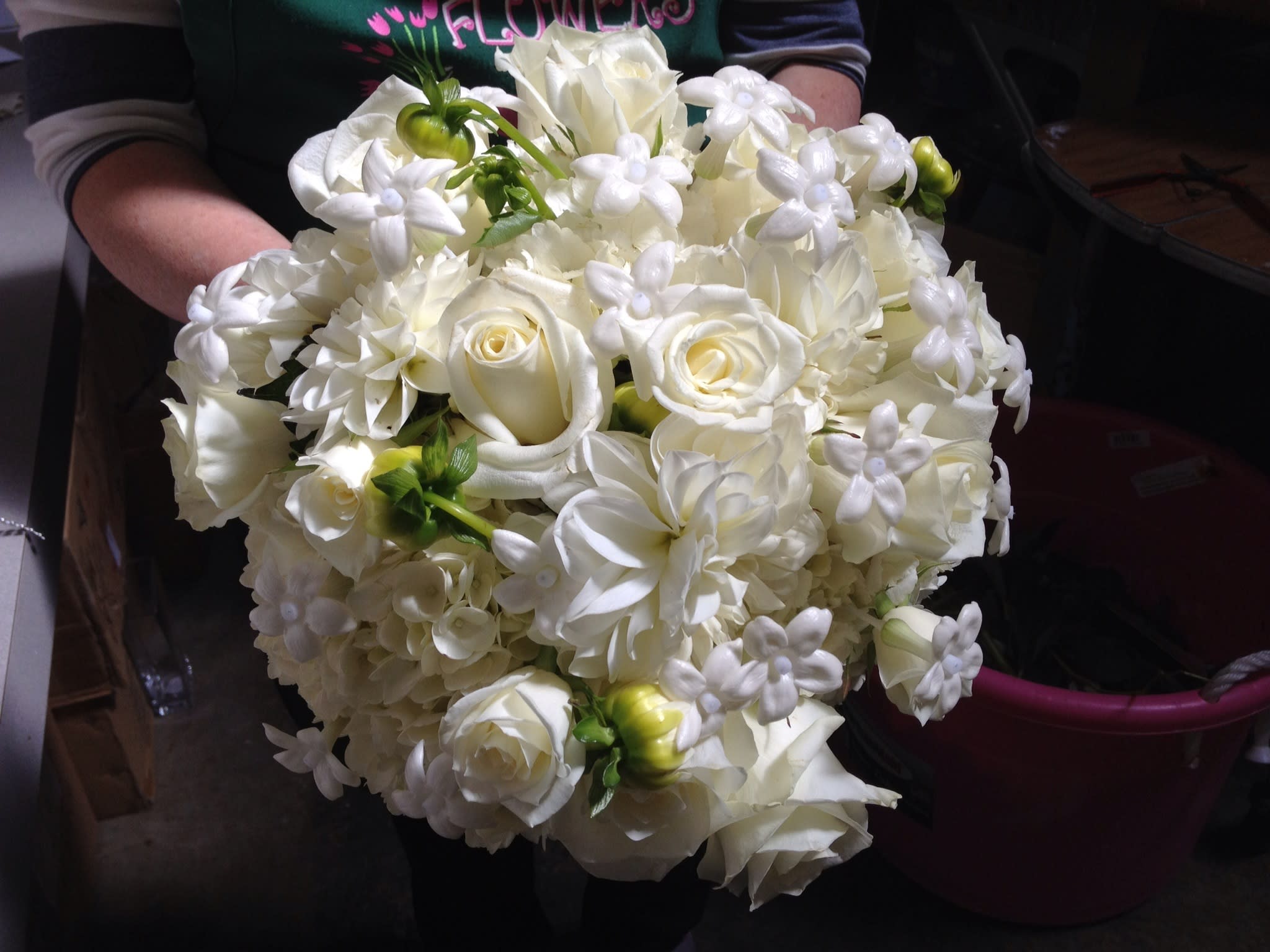White rose and lily bouquet with small white filler flowers