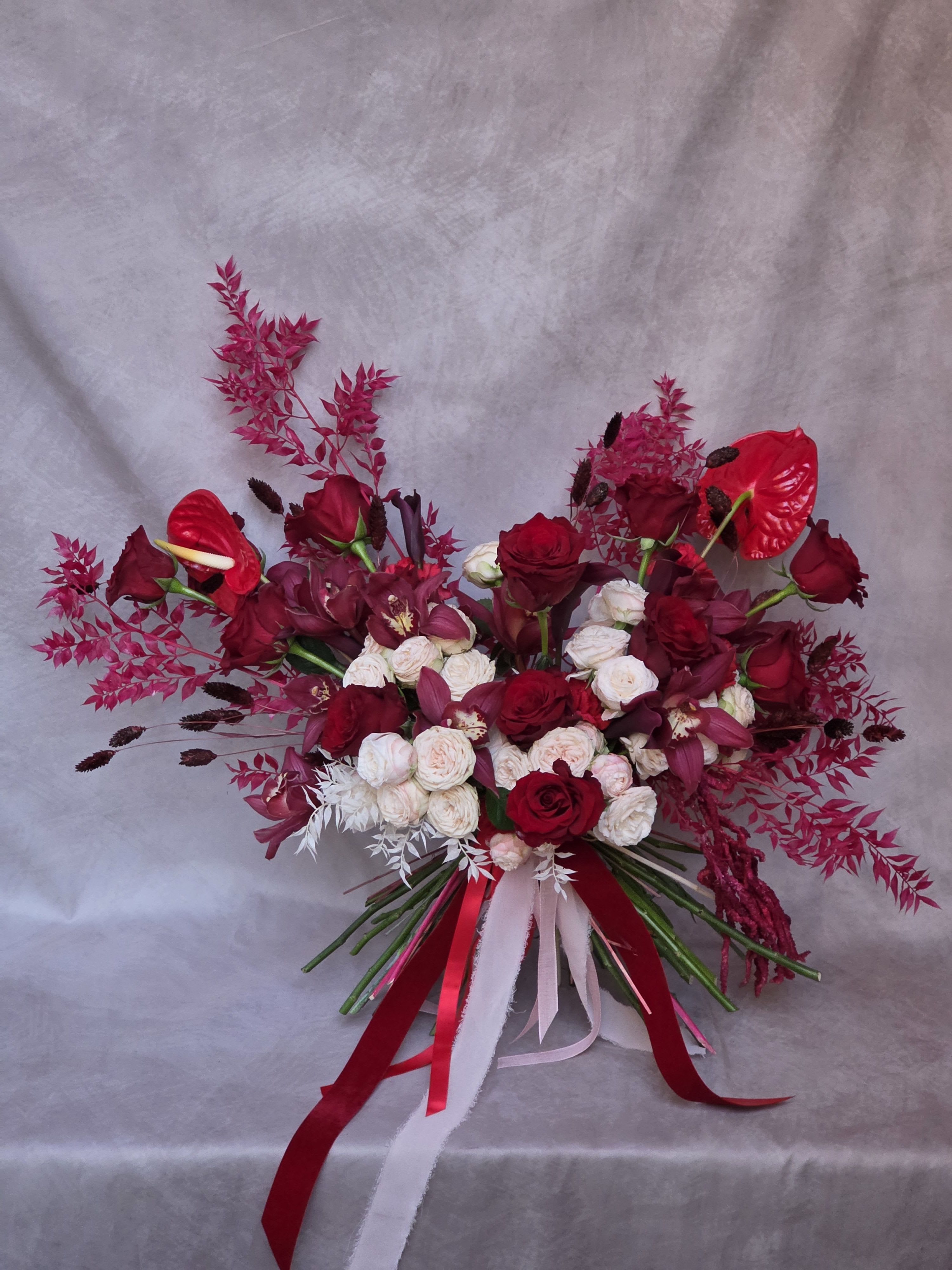 Crimson Kiss - Crimson Kiss is a high-end floral boutique where romance meets refined luxury. Specializing in an elegant palette of deep crimson reds and soft blush pinks, each arrangement is designed with a couture-inspired touch—tall, graceful, and effortlessly sophisticated.