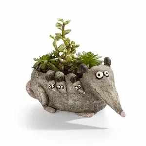 Hattie the Mama Opossum Planter with Air Plant or Succulent by Gesine Kratzner by Blob House - Hattie, the Mama Opossum Planter and her three children make a charming addition to your home, office, plant stand or jungle. Filled with either Tillandsia Air Plants or Succulents, this light gray resin planter will make you smile while you care for them. Planter is 2.5 Inches H x1.75Inches x 3.25 Inches Depth.