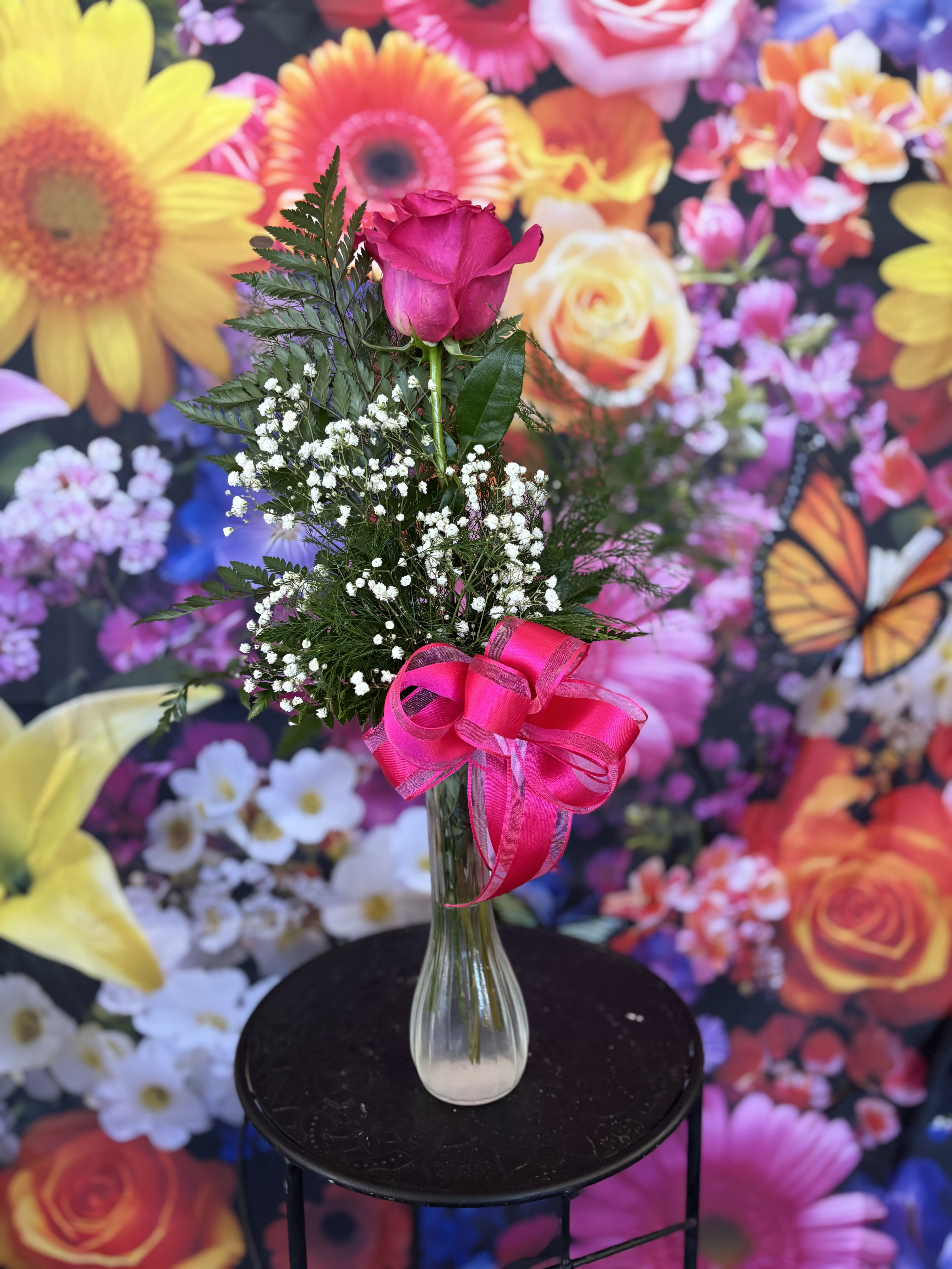 Rose  - fresh soft pink rose in bud vase setting 