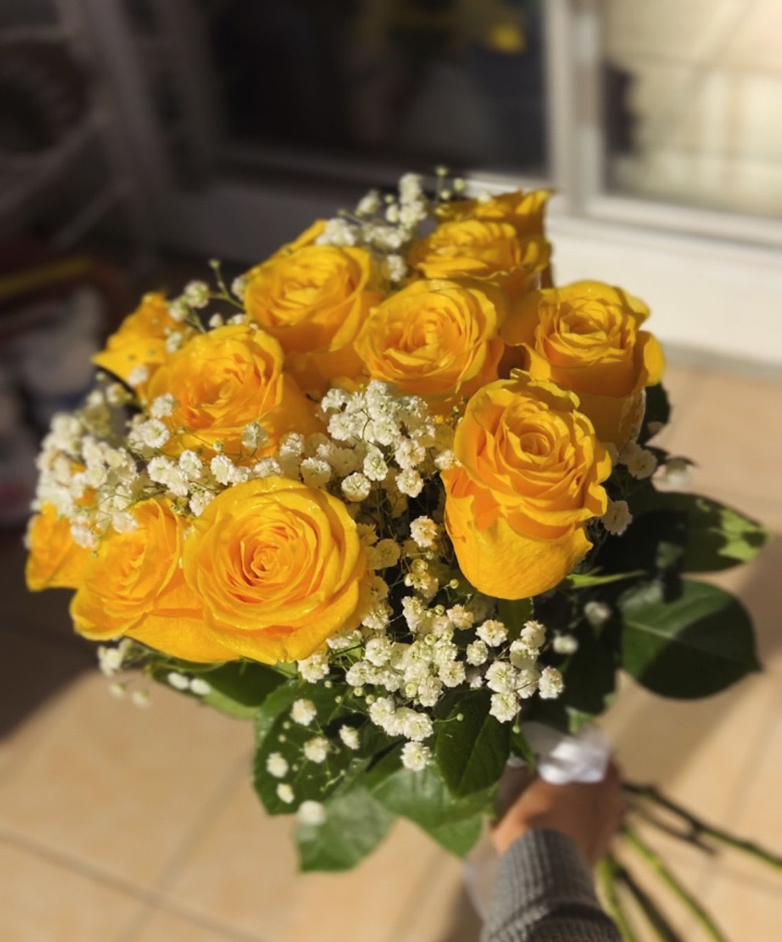 yellow dozen - one dozen roses with gyp,  laced with ribbon