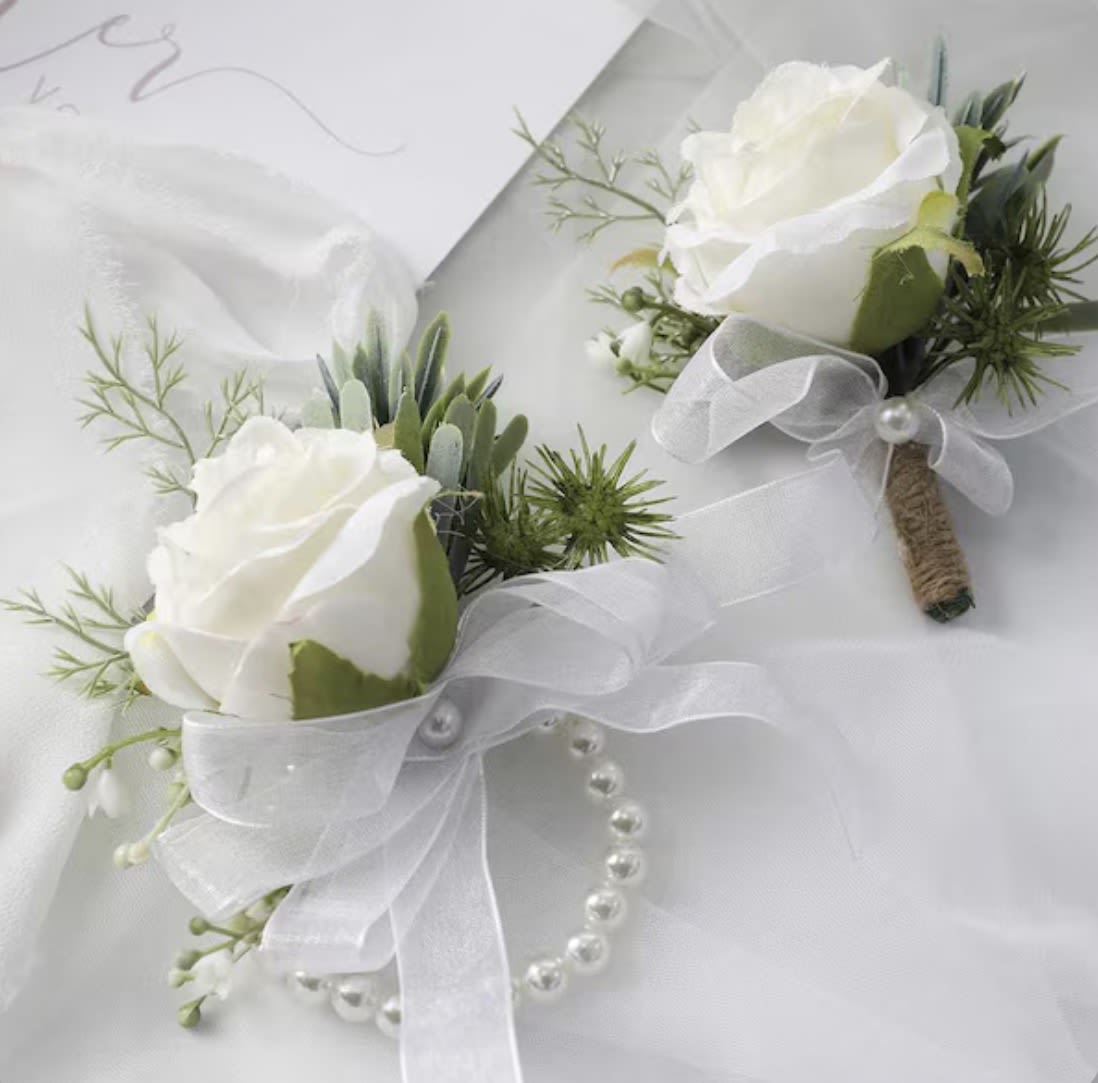 Corsage and Boutonniere Set  - A classic corsage &amp; boutonnière set that compliments any prom, formal, or wedding event. We offer coordinating rose and ribbon color accents to match palettes or styles. Pearl bracelet and pins included.   Optional flower upgrades or additions available at an additional cost. 