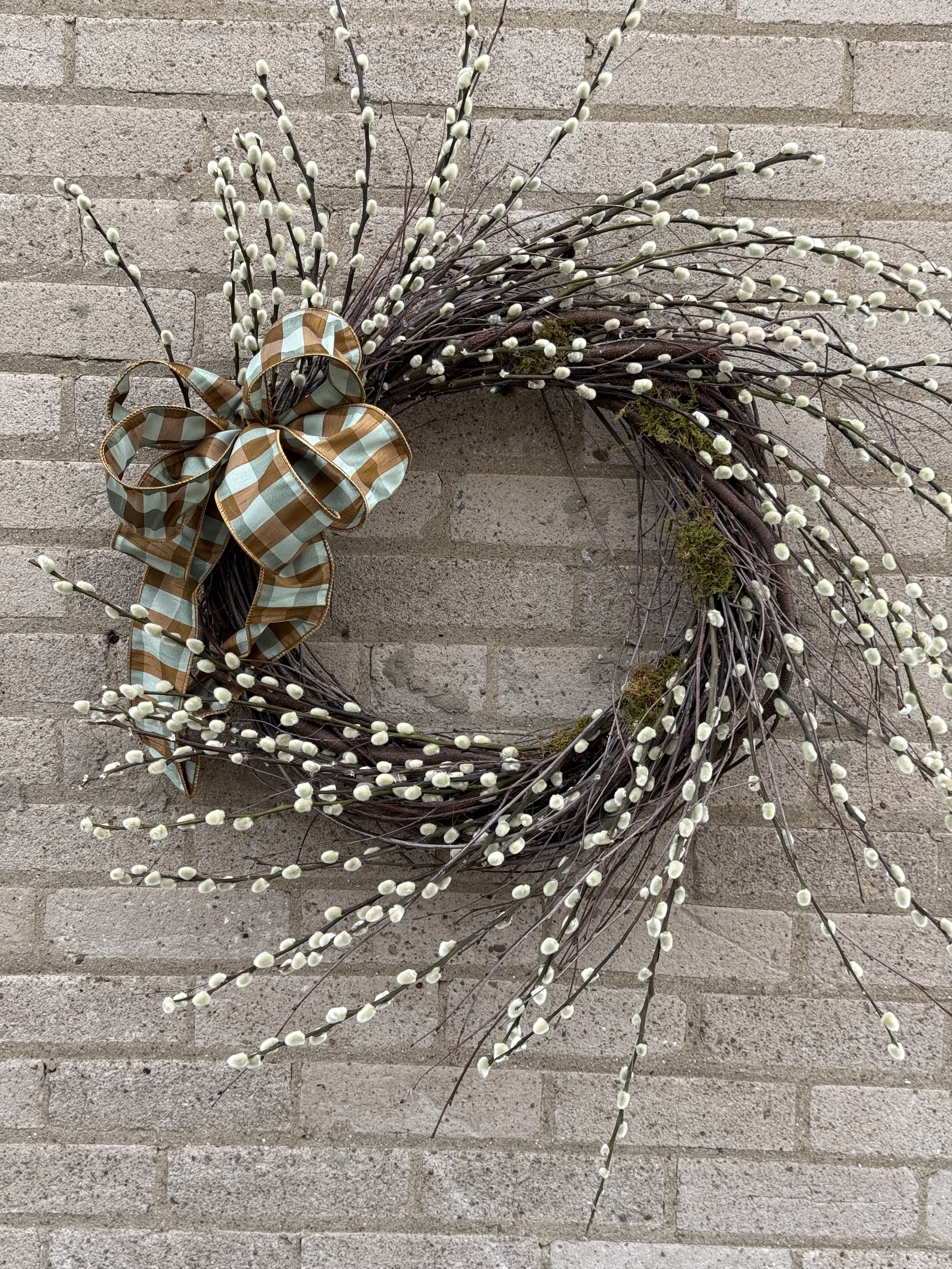 Pussy Willow Wreath - This beautiful wreath made of pussy willow branches and a gorgeous bow is custom made by our talented florists and is a wonderful gift for a thank you or a birthday gift