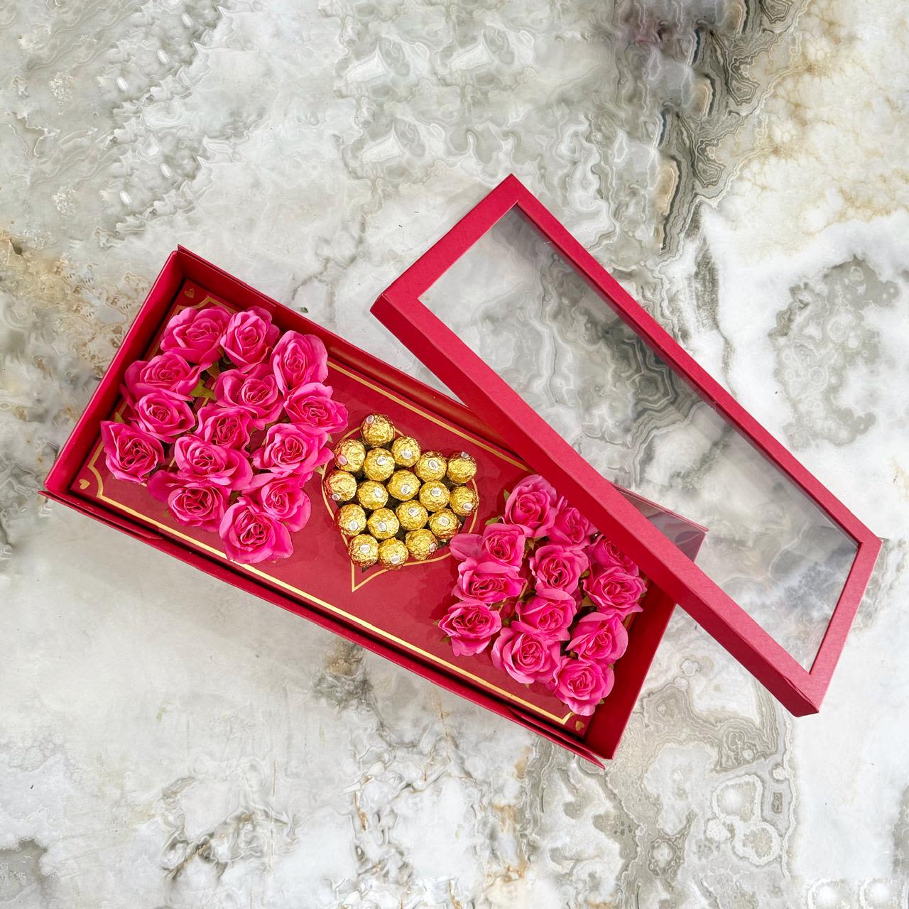 MOM Mother's Day Box - Surprise mom with this luxurious box that perfectly combines elegance and sweetness. It features approximately 26 to 30 fresh roses arranged to spell out MOM, along with 18 delicious chocolates that will make this gift simply unforgettable.  Make it personal: If you’d like to change the color of the roses to better match mom’s style or your special message, no problem! Just let us know in the NOTES FOR THE FLORIST or SPECIAL INSTRUCTIONS section when placing your order. We’ll be happy to make the change to ensure the arrangement is exactly as you envision.  Every detail is designed to make her feel truly special.  A little note for you, who choose with love:  All our arrangements are handmade with fresh flowers that arrive and bloom in their own natural rhythm. That’s why some flowers may be more open or closed compared to the photo. Also, depending on the season, certain shades or flower types may vary slightly. If any flowers are unavailable, we’ll make thoughtful substitutions to ensure the arrangement keeps its essence, beauty, and value. Rest assured, your bouquet will be just as gorgeous (or even more) than the one you see her