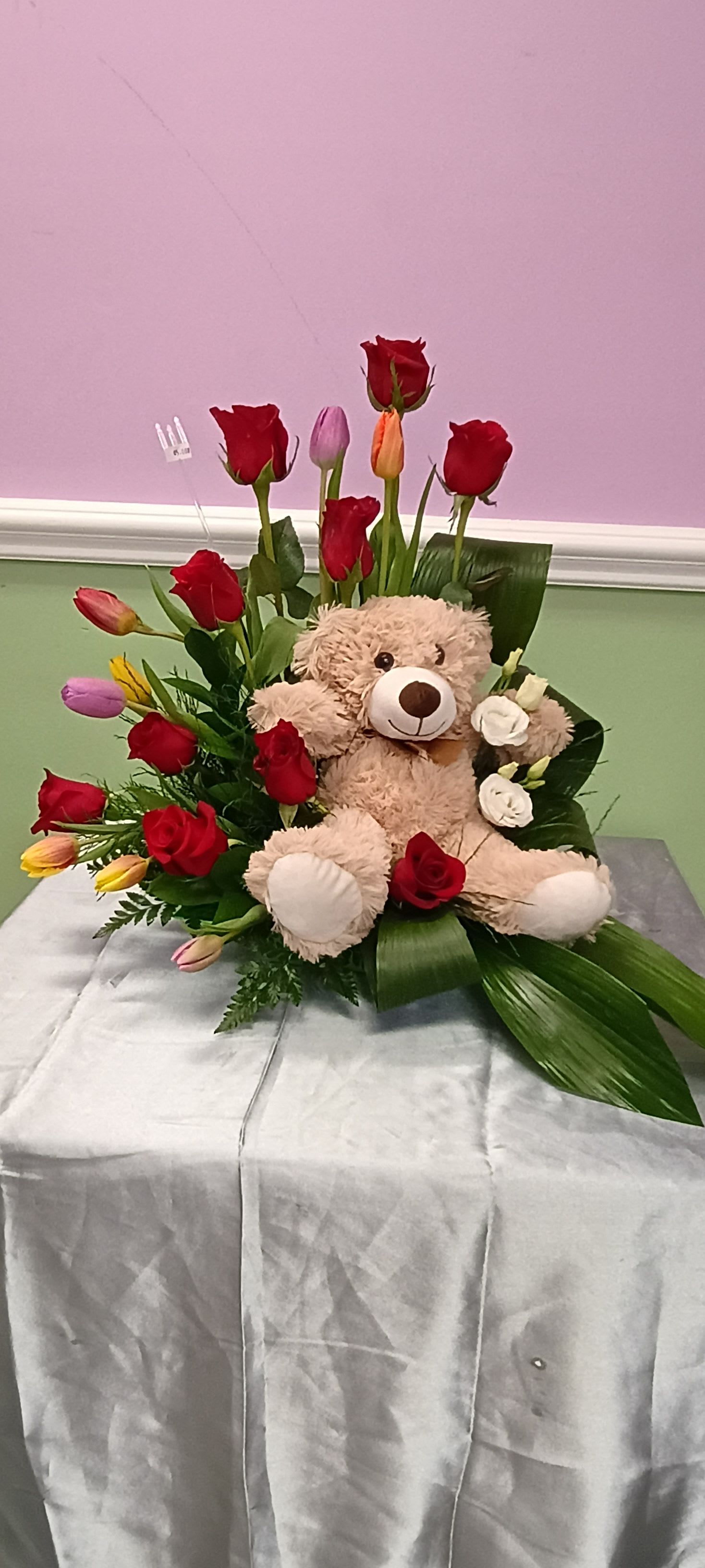 Dazzling tulips and roses  - Roses and tulips coming together to give this teddy bear a better way of telling your loved ones you love them, teddy bear may be similar.