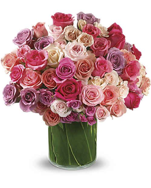 Rose Rapture - If you love her, show it in a big, big way. Pull out all the stops with this breathtakingly magnificent array of luscious roses - pink, light pink, lavender - artistically arranged in a trendy vase. Sure, it's extravagant. But she's worth it. The elegant bouquet includes hot pink roses, lavender roses, light pink roses, pink roses, light pink spray roses, and lavender spray roses accented with assorted greenery.
