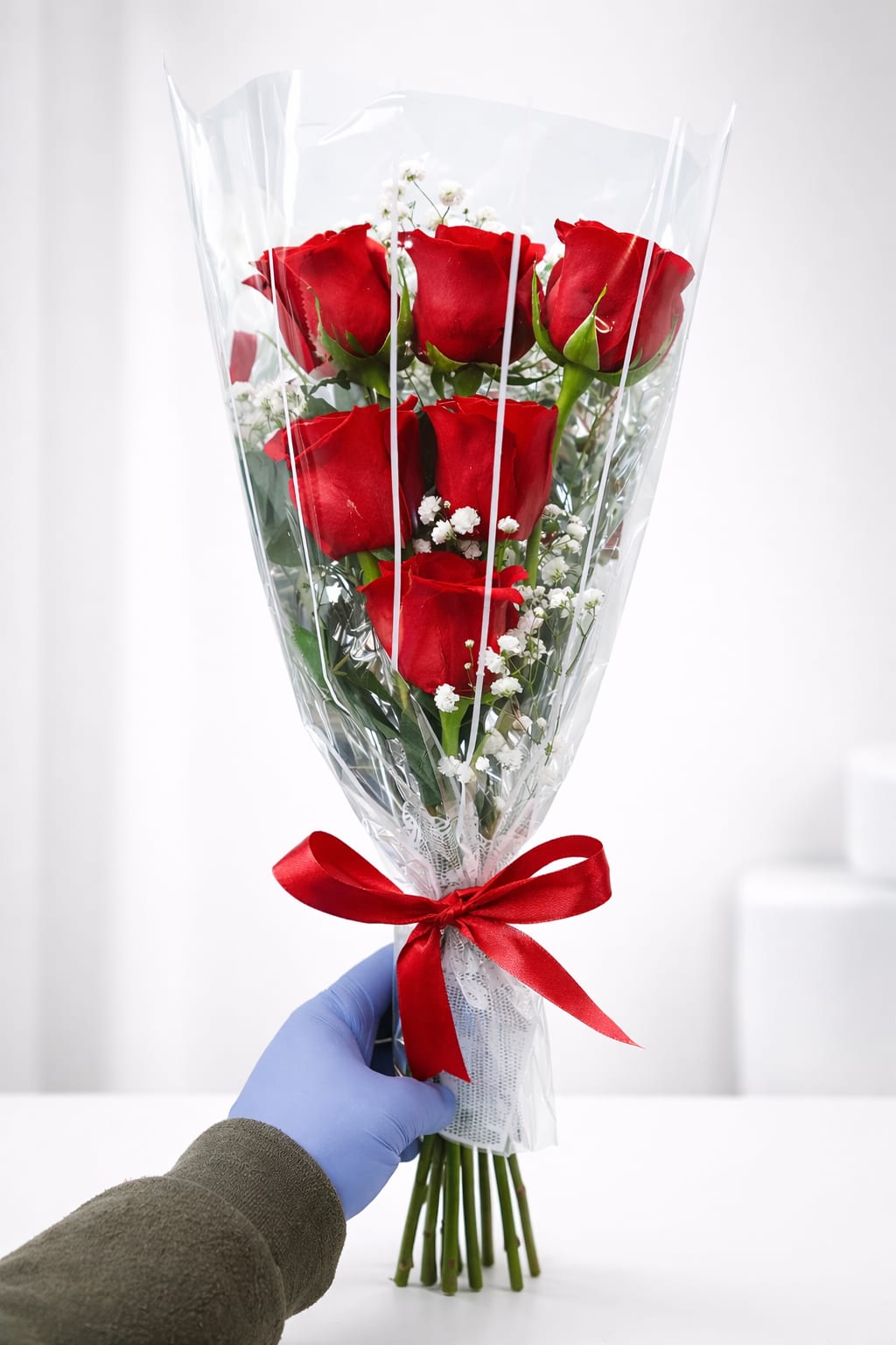 Classic roses red bouquet  - A timeless bouquet of 6 premium red roses accented with delicate baby’s breath, wrapped in clear elegant cellophane and finished with a satin ribbon—perfect for romantic gestures, anniversaries, or simple heartfelt gifts.