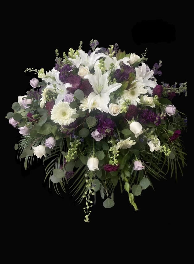 Pop of Purple - Purple, lavender and white mixed flower casket.