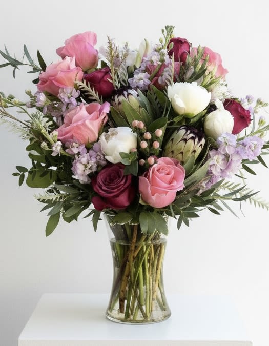 Mothers Finest - Available week of Mother's Day - A large bouquet of our favorite roses peonies, accent florals and flowing greens and protea