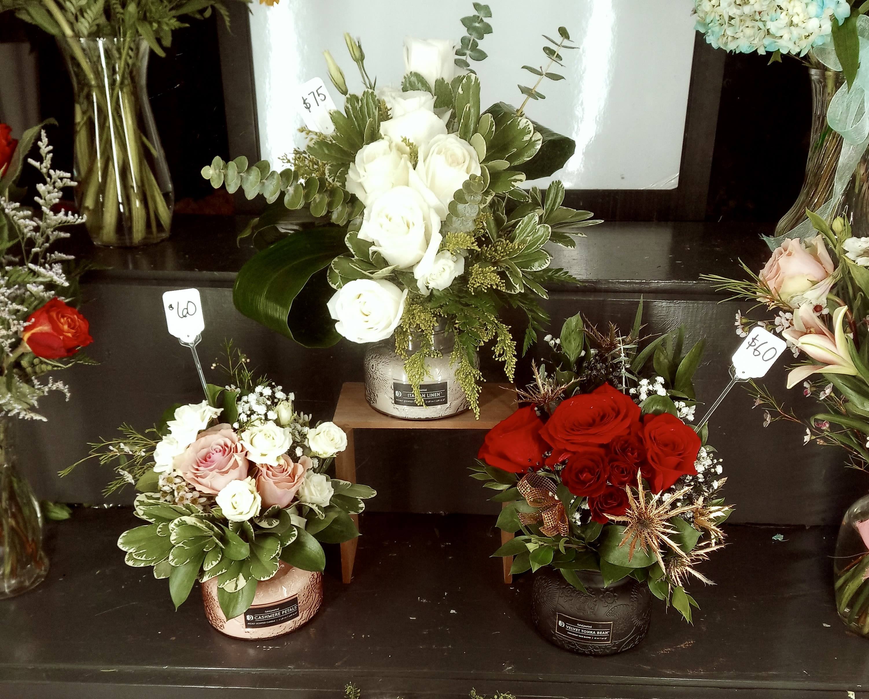 candle flower arrangements - So not only do you get the lovely fragrance of flowers but the wonderful scent of a candle that lasts. Candles vary by color and scent. We usually try to match the flowers to the color of the candle, but fill free to leave comments if you want it more customized. Or just give us a call.