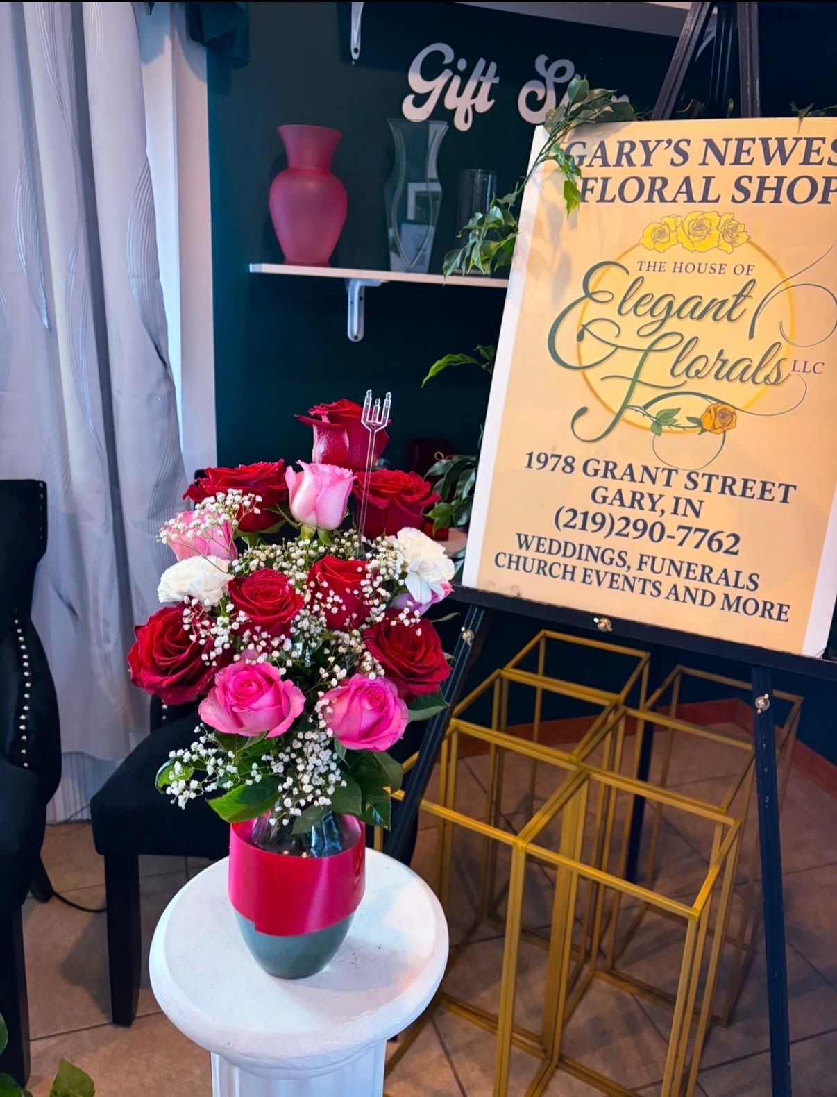 Blushing Romance - A romantic and timeless mix of rich red and soft pink roses, accented with delicate baby’s breath and lush greenery. Designed in a modern glass vase with a bold red wrap, this arrangement is perfect for anniversaries, Valentine’s Day, or expressing heartfelt love.  