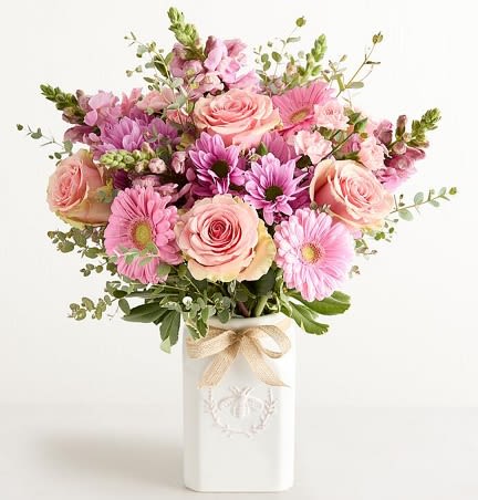 Honey Bee - Rounded bouquet of blush roses, pink gerbera daisy blooms and lavender daisies &amp; accents in a tall white ceramic bee vase, ribbon-tied
