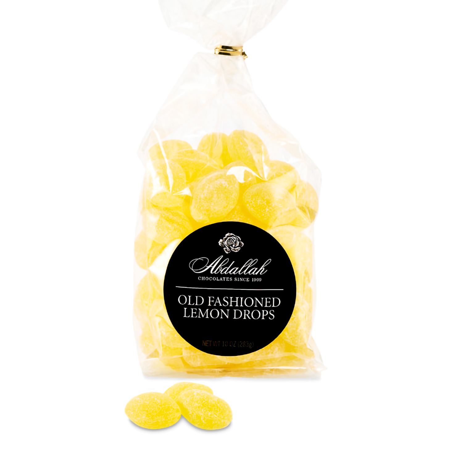 Bag of yellow old fashioned lemon drop candies with black round label and a few candies in front