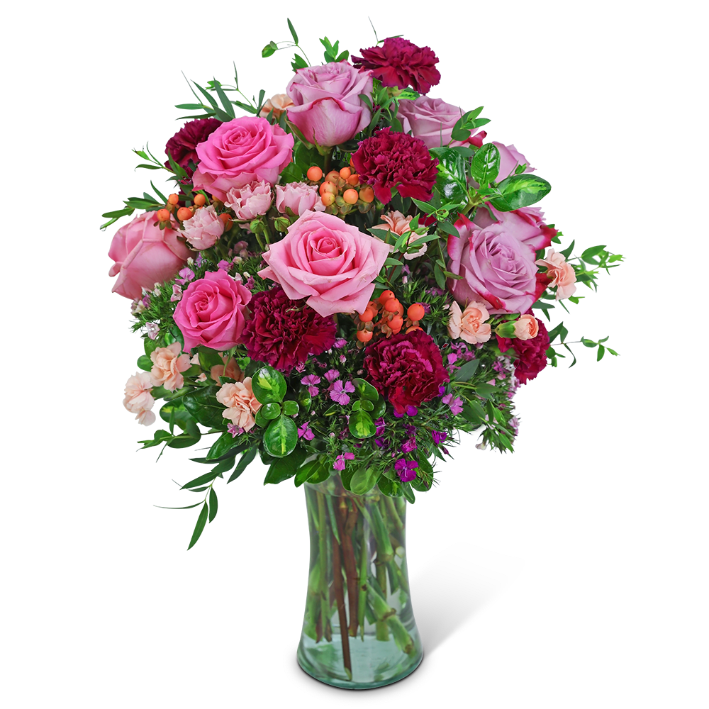 Pink and magenta rose bouquet in a clear glass vase