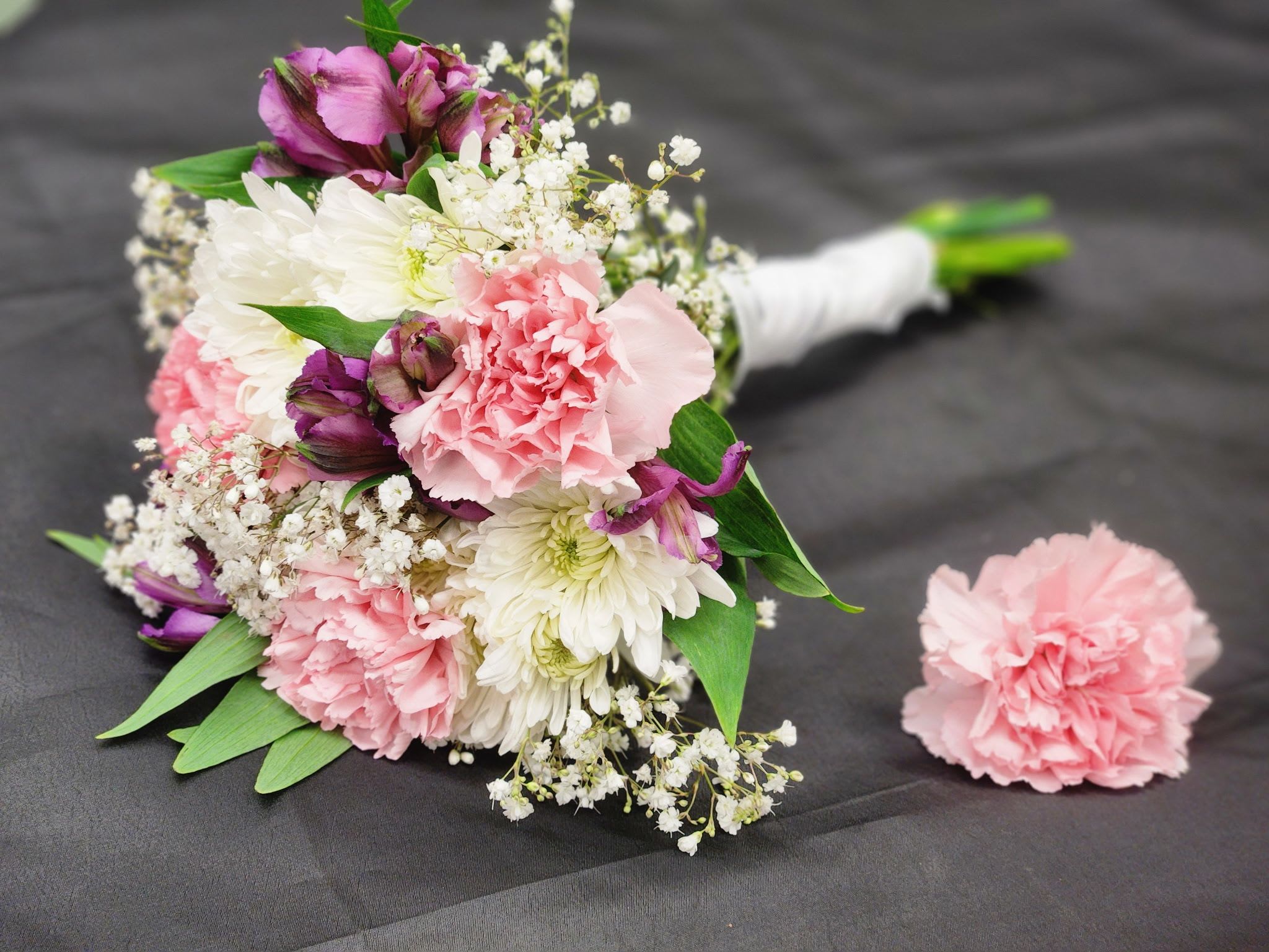 Pink Carnation Prom Bundle - Prom Bundle! This mini prom-bouquet features pink carnations, purple alstromeria and babies breath and a pink carnation boutonniere. Order as shown, or ask for different colors in the special instructions area.