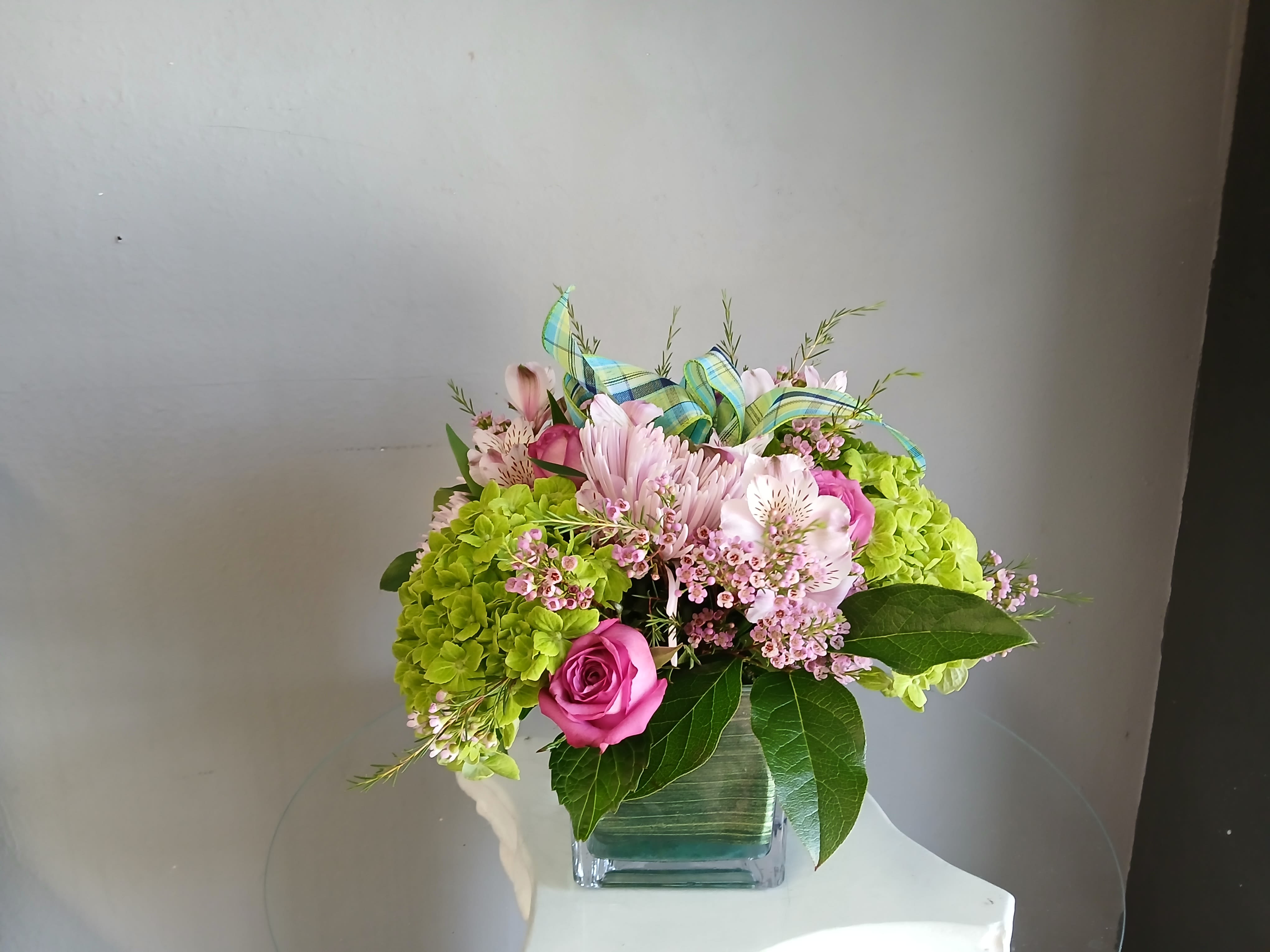 #716 Designer's Choice Vase Arrangement - This beautiful flower arrangement of fresh mixed seasonal blooms is made by local designers in the heart Orange California. Hand crafted and perfect for every occasion, from birthdays and new babies to sympathy and just because. The best choice to show you are thinking of that special someone. Can be sent as a local delivery or in-store pickup. This is an original, one of a kind arrangement. Order now before it's too late!  UPGRADES: All upgrades are applied at the designer’s discretion and fulfilled to value using the freshest seasonal and/or premium flowers available. Container upgrades may be included when possible; otherwise, value is reflected in the floral selection while maintaining the original design style.