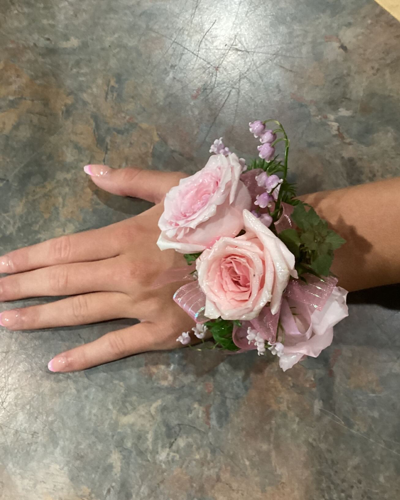 BABY PINK ROSE PROM CORSAGE - An example of a corsage with baby pink roses and ribbon. Other colors may be available based on color/ribbon availability. Please text Darlene at 419-636-7813 with a picture of your dress so we can match the corsage to the dress