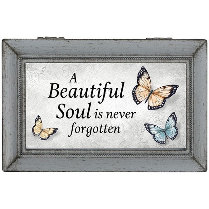 Framed memorial sign with butterflies and the words "A Beautiful Soul is never forgotten"