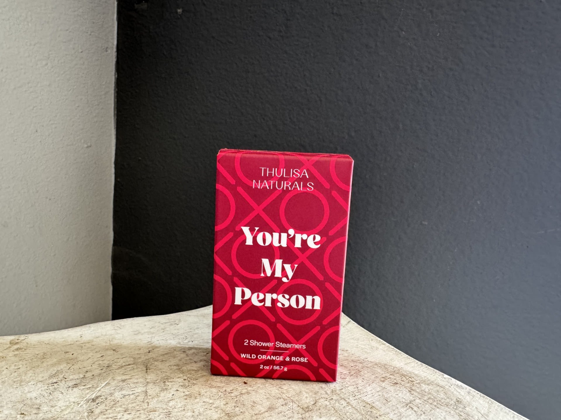 Red gift box labeled "You're My Person" on a tabletop