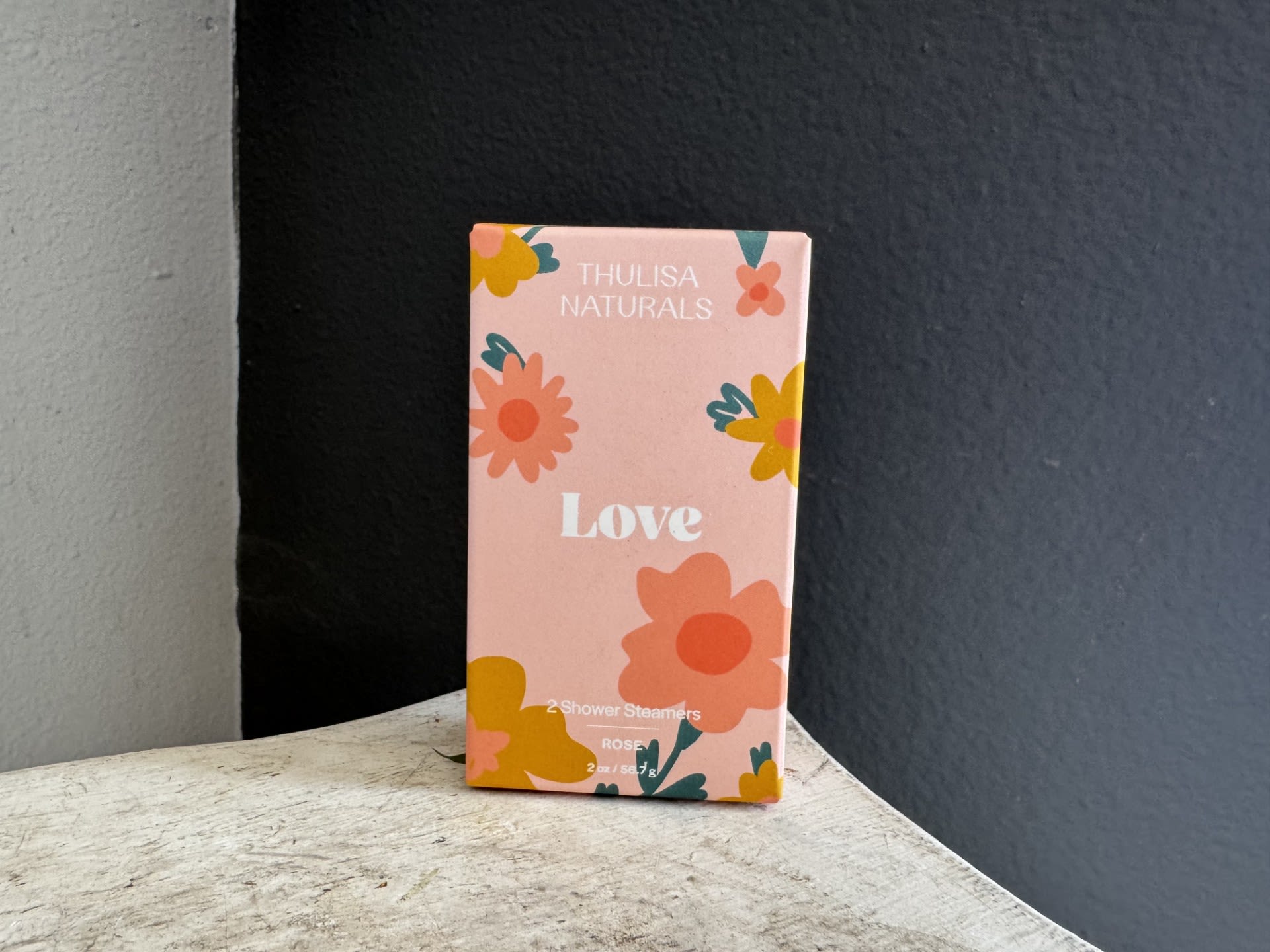 Pink floral product box labeled Love by Thulisa Naturals