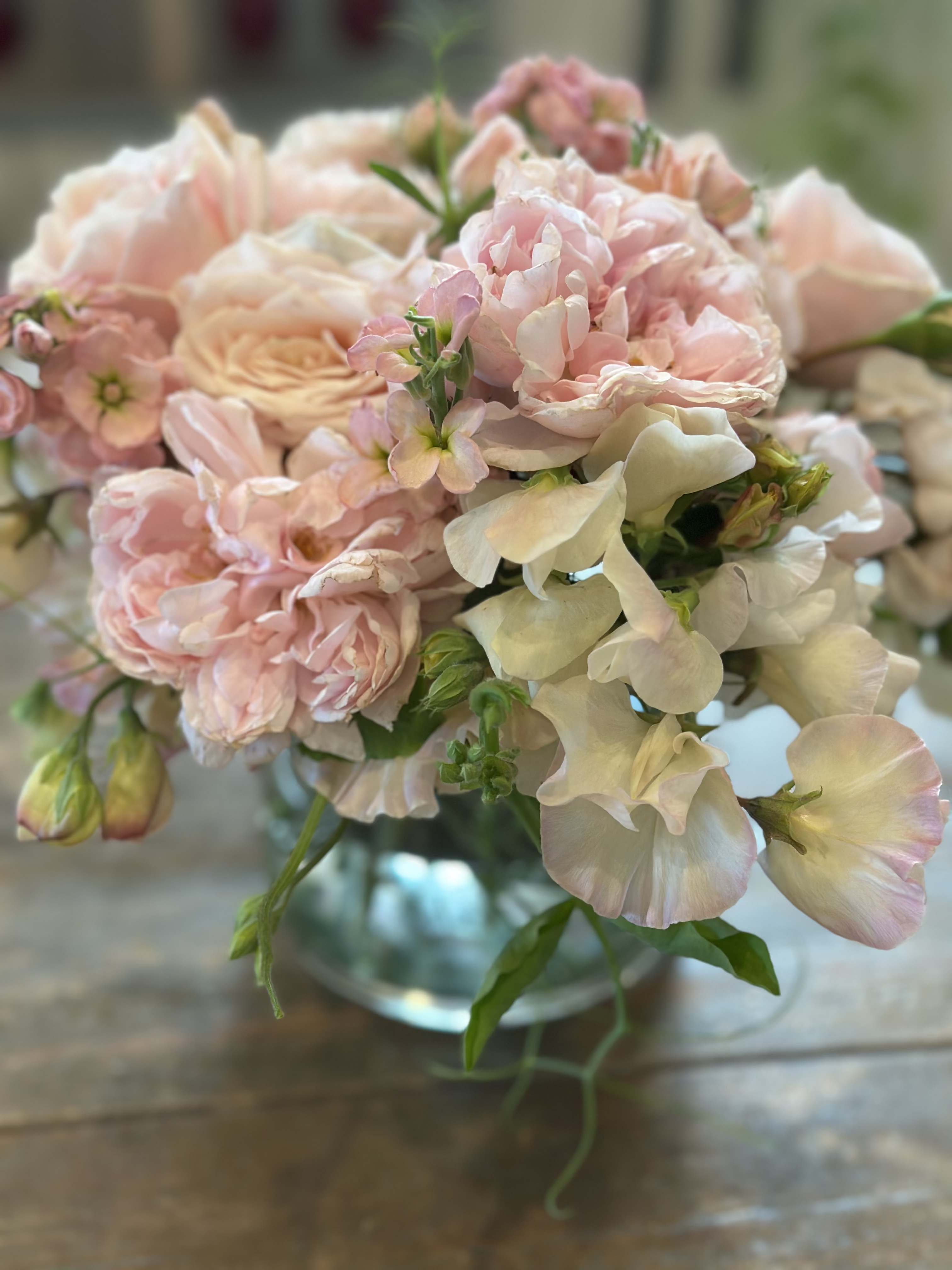 Blush pink and cream bouquet in a glass vase