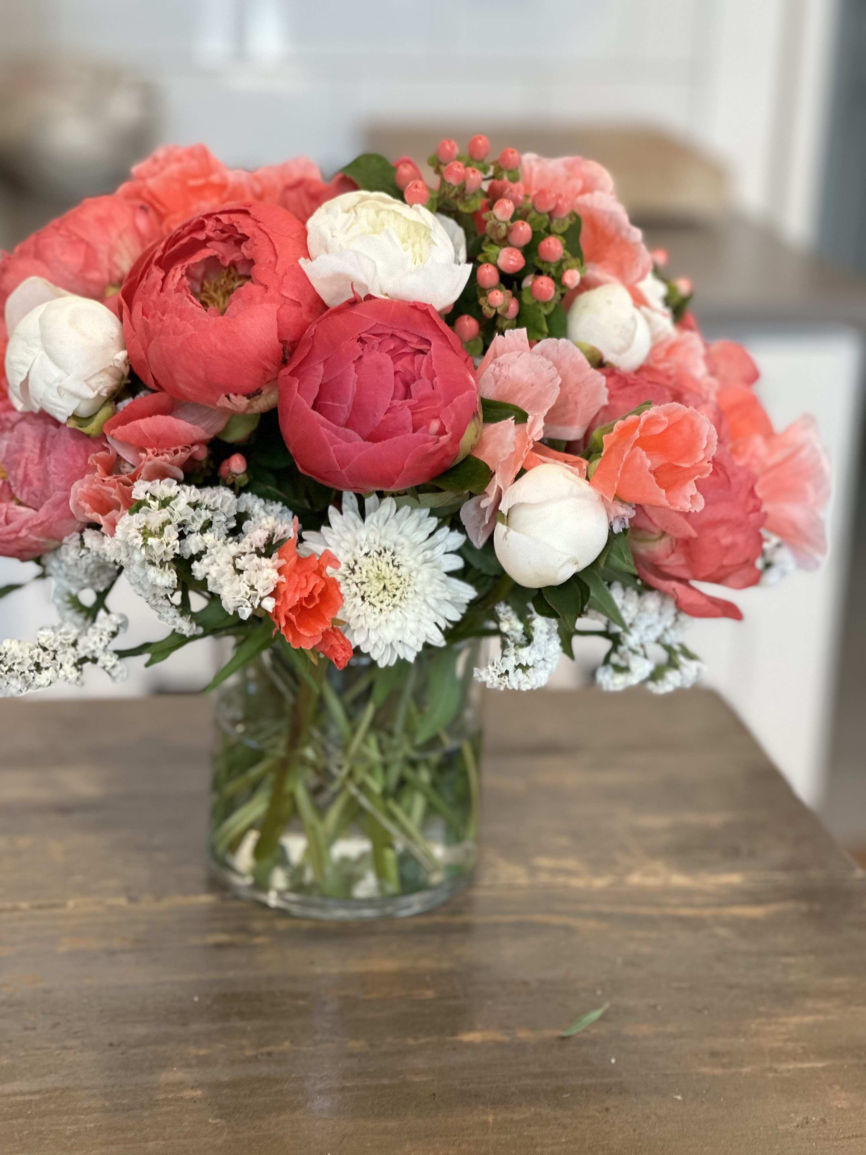Pink and white mixed bouquet in a clear glass vase