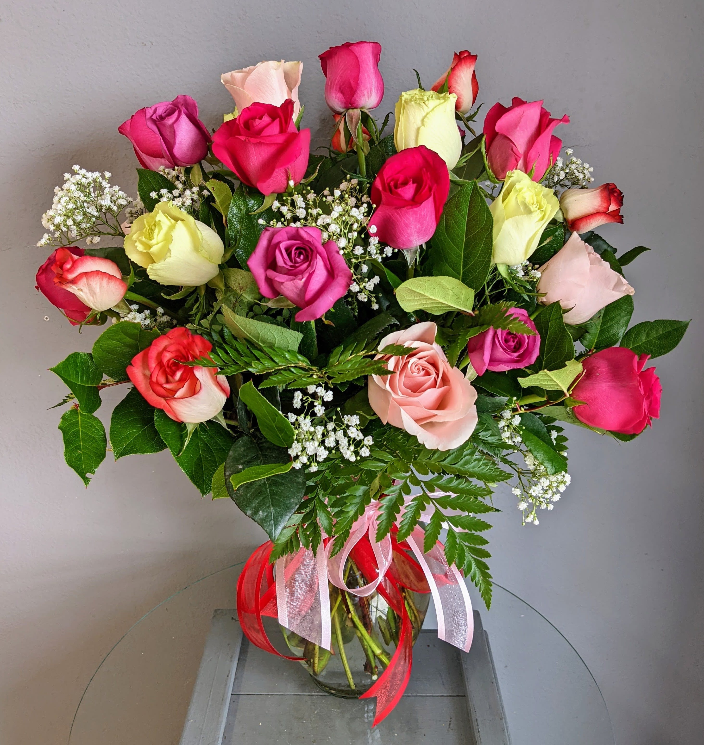 2 Dozen Mixed Colored Roses  - Do you love roses but not red..... we got you! Our stunning 2 dozen MIXED colored roses is designed in a vase with filler and greens using fresh 60 centimeter, long-stem imported roses &amp; is the perfect alternative.  Colors, filler, vase and greens WILL vary.  ***PLEASE NOTE*** * Bloomsnaps and timed delivery are not available during Valentines day (2/12-2/14)  *** Please be flexible. Based on quality and/or availability, Substitutions of equal or greater value may be made at the designer’s discretion (including flowers, greens, filler, vase and hard goods) without notice