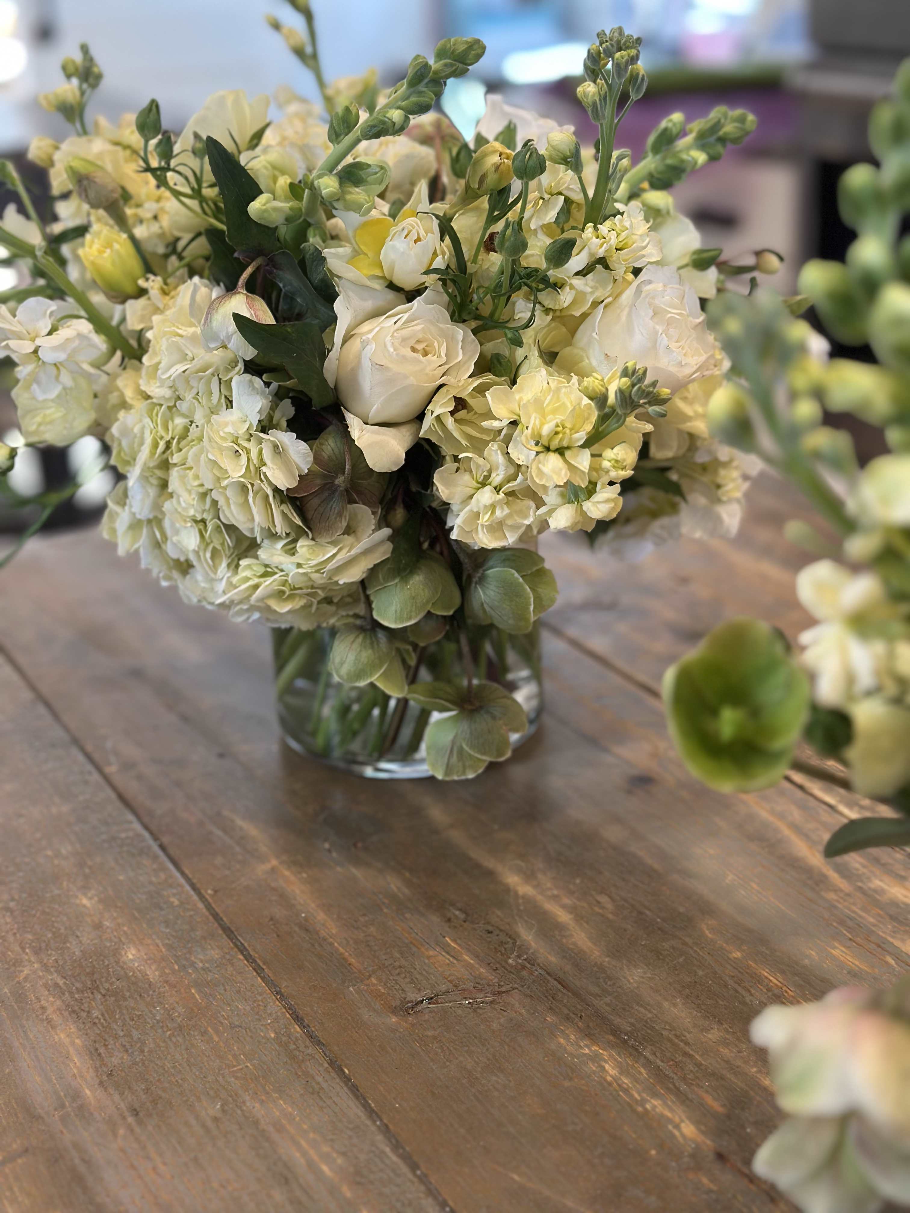 Cream and pale yellow bouquet in a clear glass vase