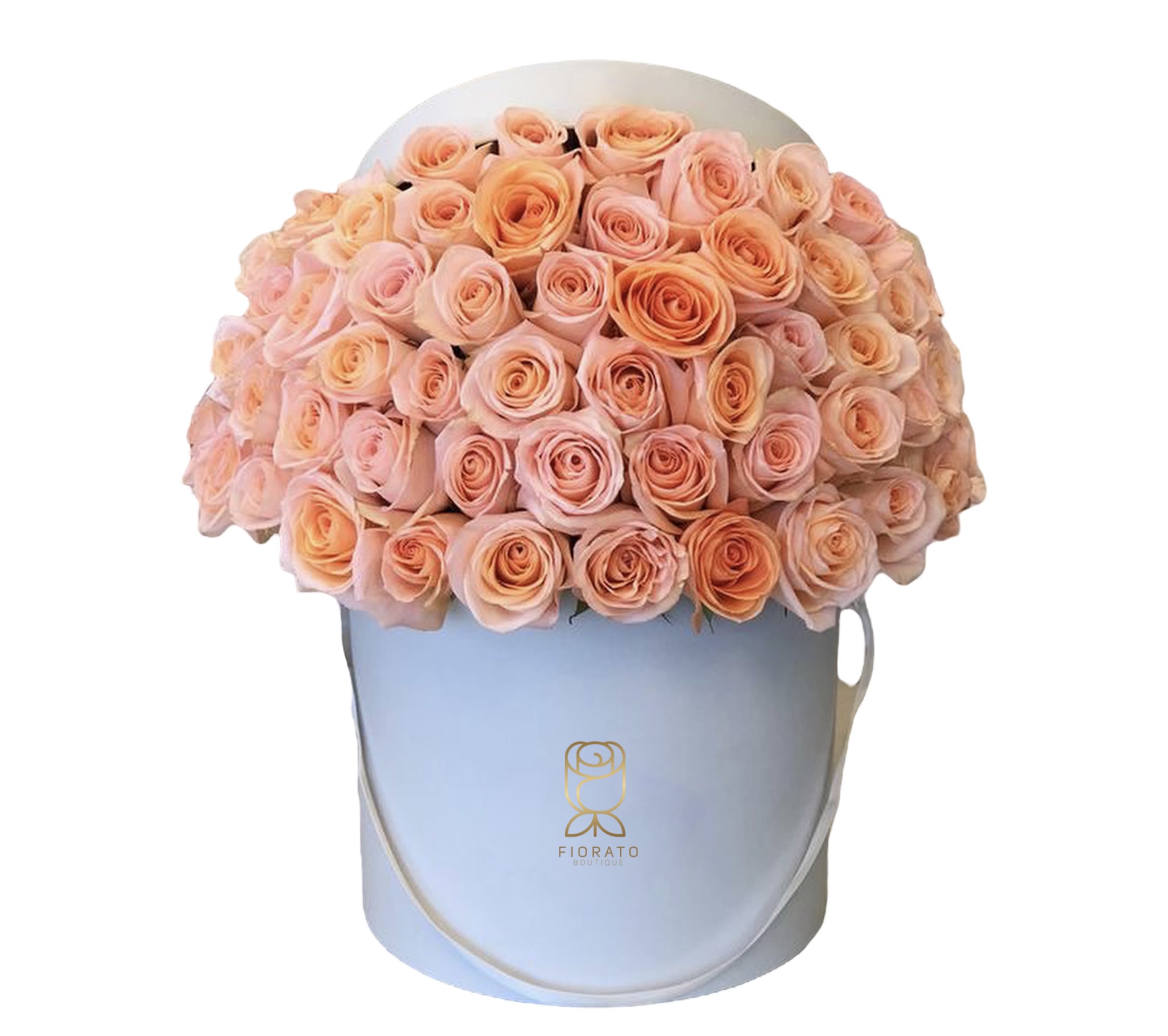 Peach and blush roses arranged in a light blue hatbox