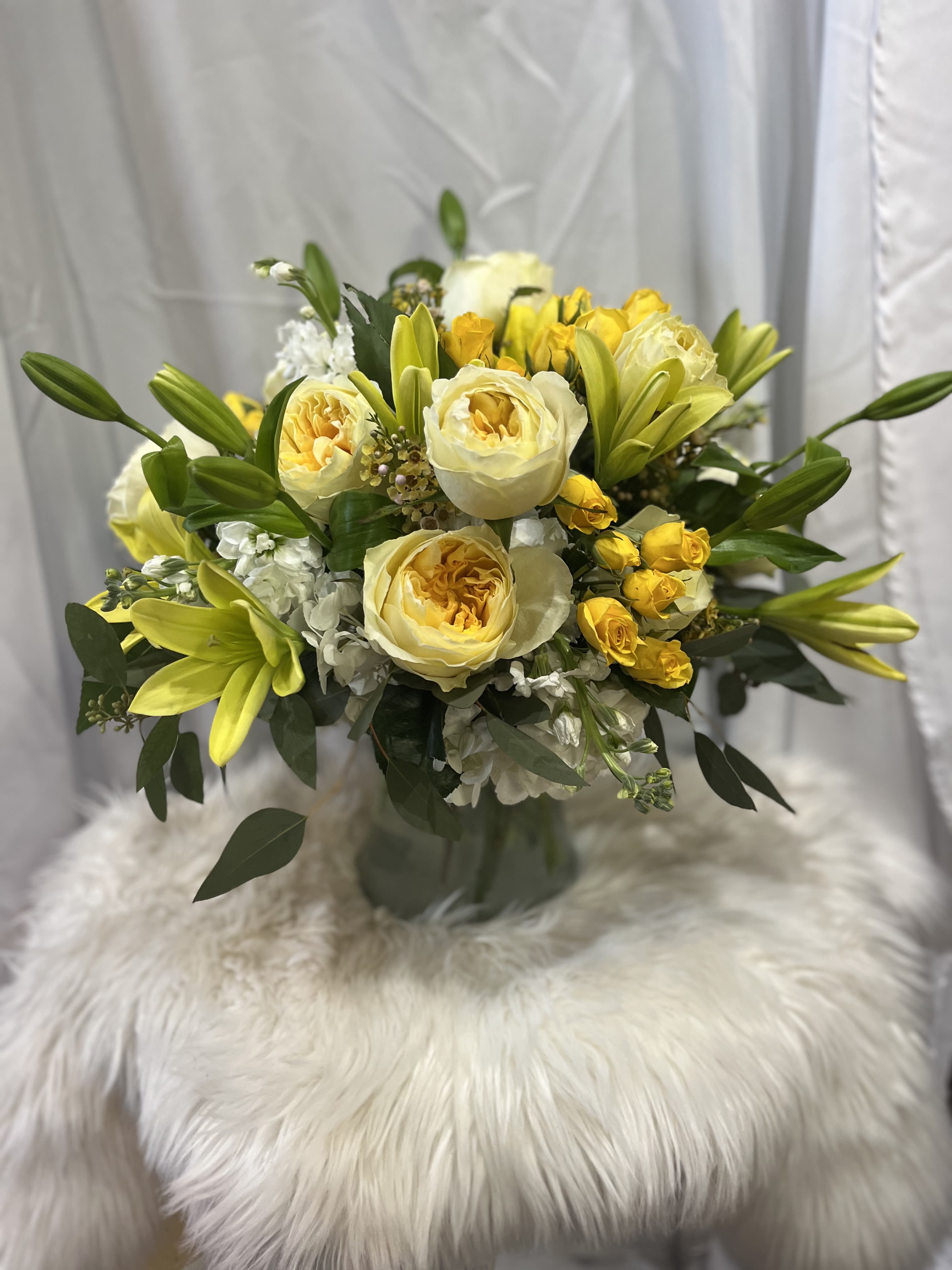 Felicity - Florals and colors are dependent upon availability.