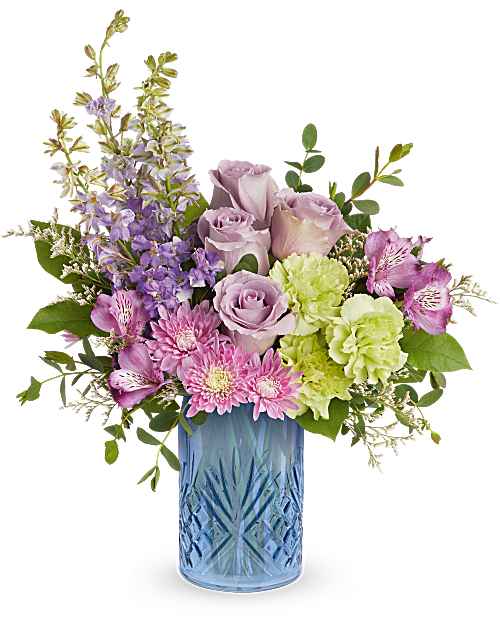 Garden Whimsy Bouquet - Garden Whimsy Bouquet is a charming Mother's Day flower arrangement featuring lavender roses, purple alstroemeria, green carnations, lavender larkspur, lavender cushion spray chrysanthemums, and white limonium, accented with lemon leaf and parvifolia eucalyptus, delivered in Teleflora's Blue Belle Vase.