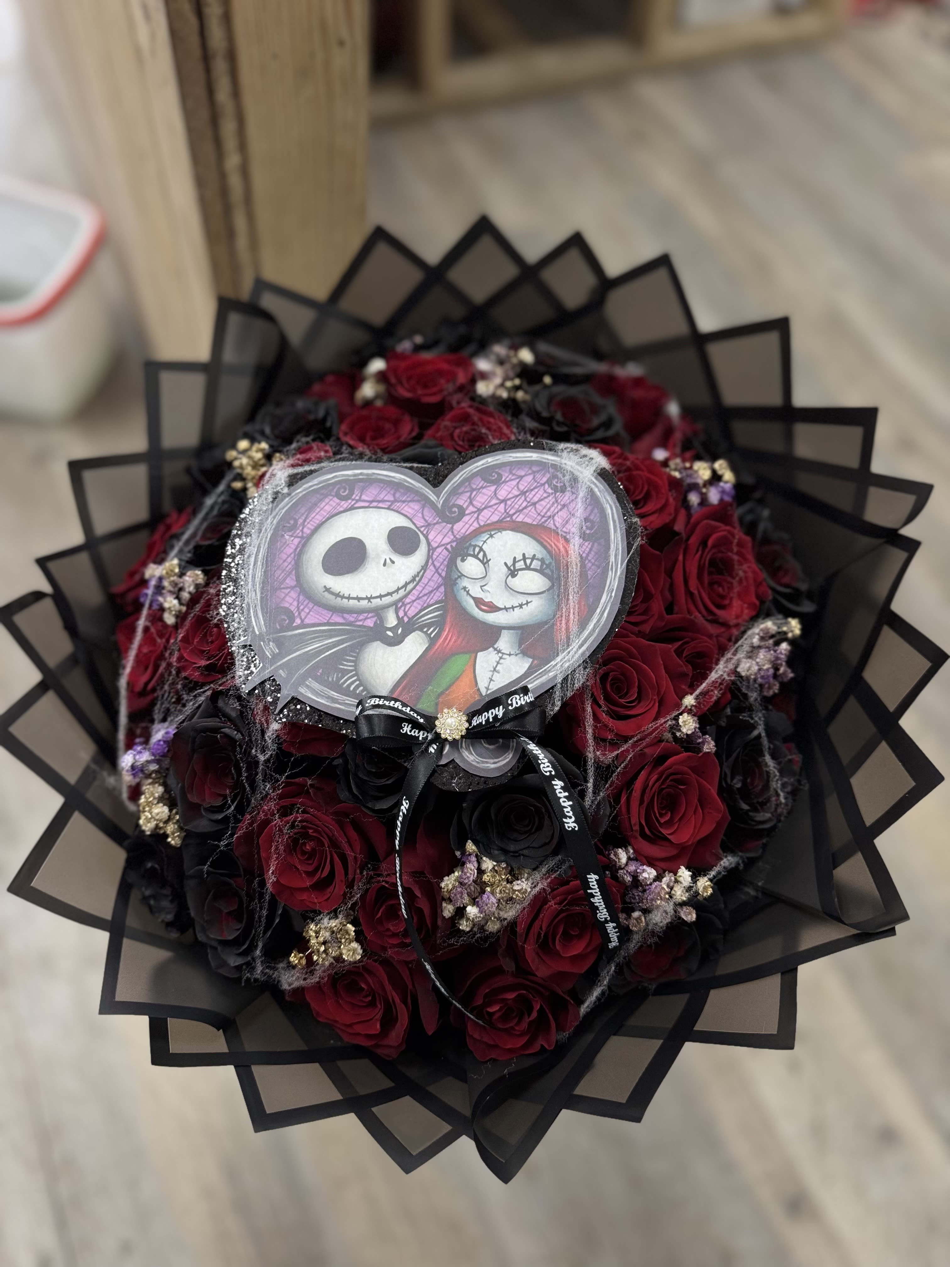 The nightmare before Christmas bouquet - A nightmare before Christmas inspired bouquet - we do, do custom bouquets just call or come into our store for more information