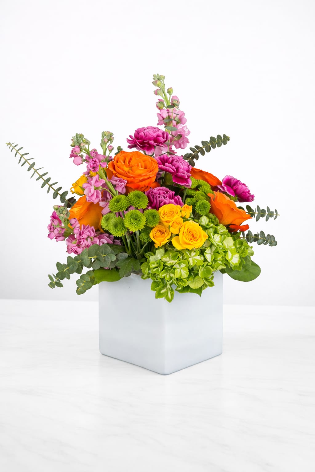 Va Va Bloom  - Turn up the heat with the vivacious bouquet. This arrangement includes roses, carnations, stock, and hydrangea. This is the perfect gift for someone's birthday or any celebratory occasion.
