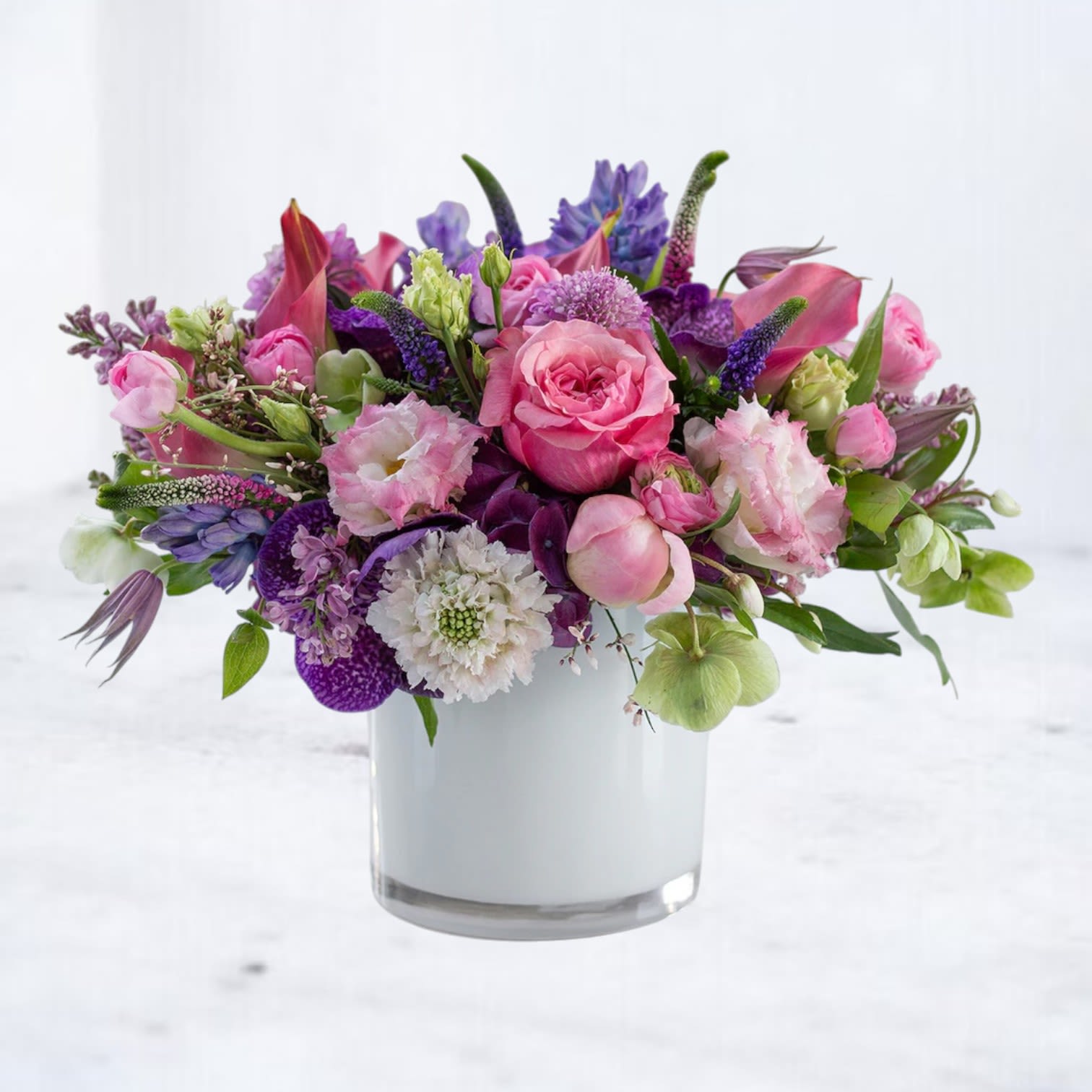 Petal Prism - Petal Prism is a bold and beautiful fusion of vibrant pink roses, lisianthus, delicate scabiosa, orchids, calla lilies, and a mix of lush spring textures — thoughtfully designed to uplift and delight. Whether you're saying thank you, sending a just because surprise, celebrating a birthday, or brightening someone's day, this vibrant arrangement makes a lasting impression.  Available for same-day flower delivery in Houston, Magnolia, Montgomery, The Woodlands, Spring, and Conroe, Petal Prism is the perfect choice for life’s everyday moments that deserve something extraordinary. Celebrate with color, express your heart, and send beauty with Petal Prism — where bold blooms meet timeless charm.
