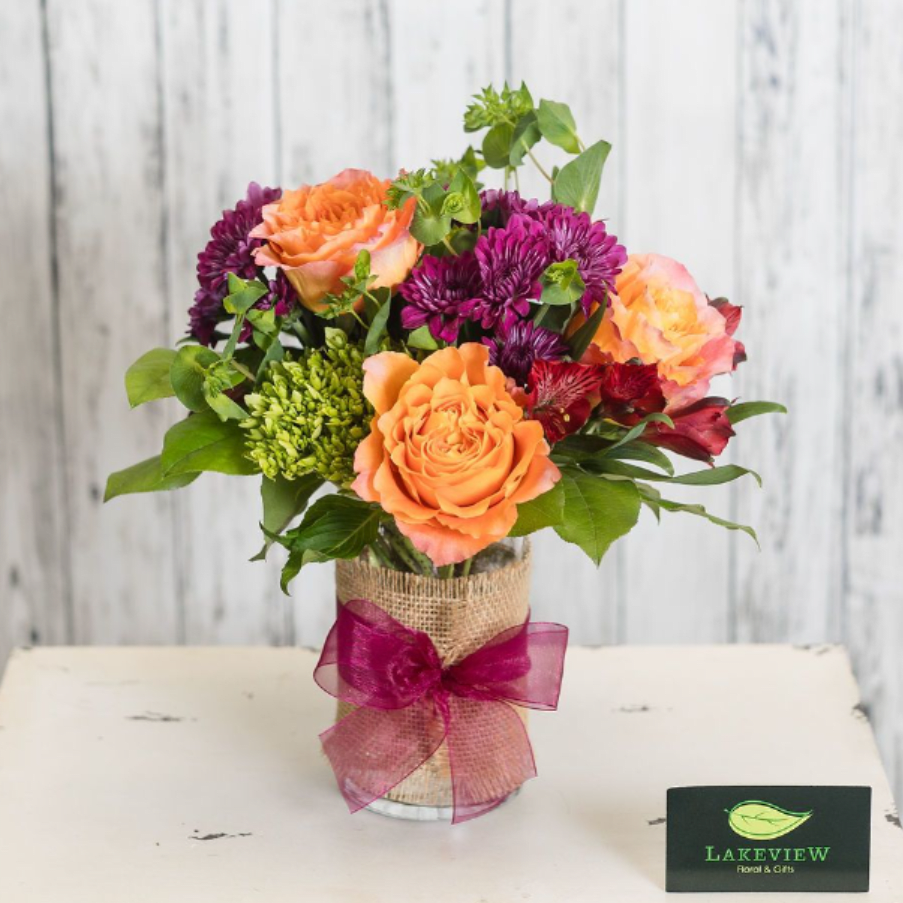 Festival - Tell them just how special they are to you with an extra- special arrangement of vibrant novelty roses, hydrangeas and alstroemeria.  It's sure to be a hit!  Approximate Dimensions: 13" H x 10" W