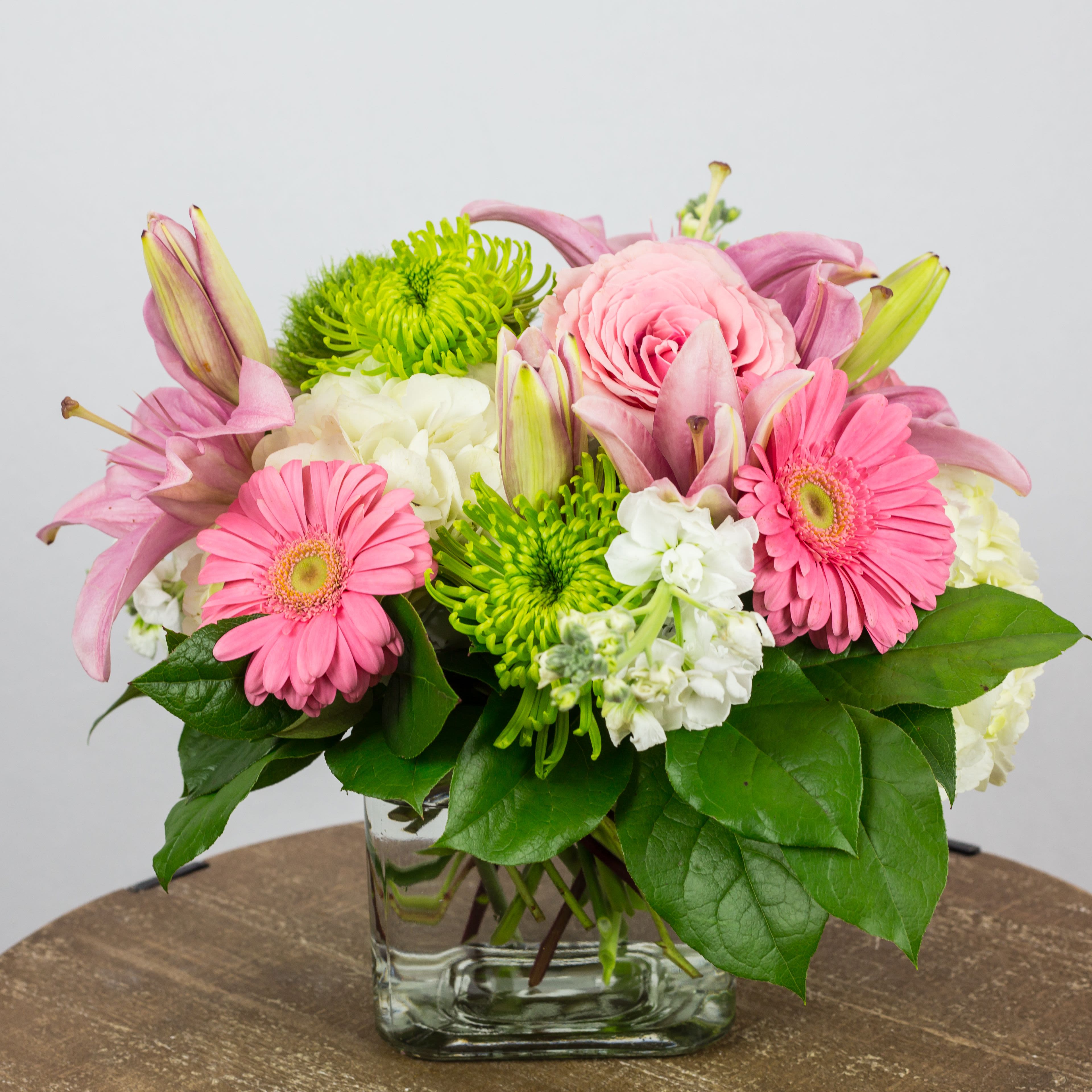 Pink and white mixed bouquet in a clear glass vase