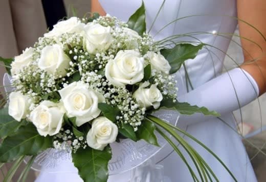 White rose bridal bouquet with baby's breath and greenery