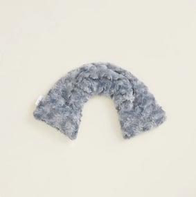 Gray fuzzy U-shaped plush item on a plain background