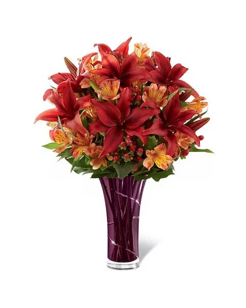 You're So Special - The You're Special Bouquet is a beautiful expression of Autumn's bounty of color and beauty. Gorgeous rust-colored Asiatic Lilies make a bold impression arranged amongst orange Peruvian Lilies, red hypericum berries and lush greens. Paired wtih an elegant designer purple glass vase, this bouquet will send your warmest wishes to your special recipient for a wonderful fall season. 