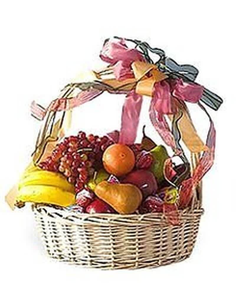 Wicker gift basket filled with assorted fresh fruit and topped with multicolored ribbons.