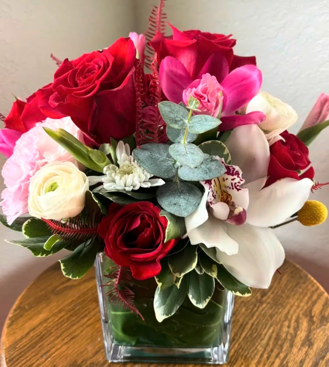 Love Harmony Blooms - Elegant romantic flower arrangement by Snyder Flowers in San Antonio featuring fresh red roses, pink roses, orchids, eucalyptus and greenery with same day flower delivery perfect for Mother’s Day, anniversaries, birthdays and special occasions with premium quality flowers at great prices.