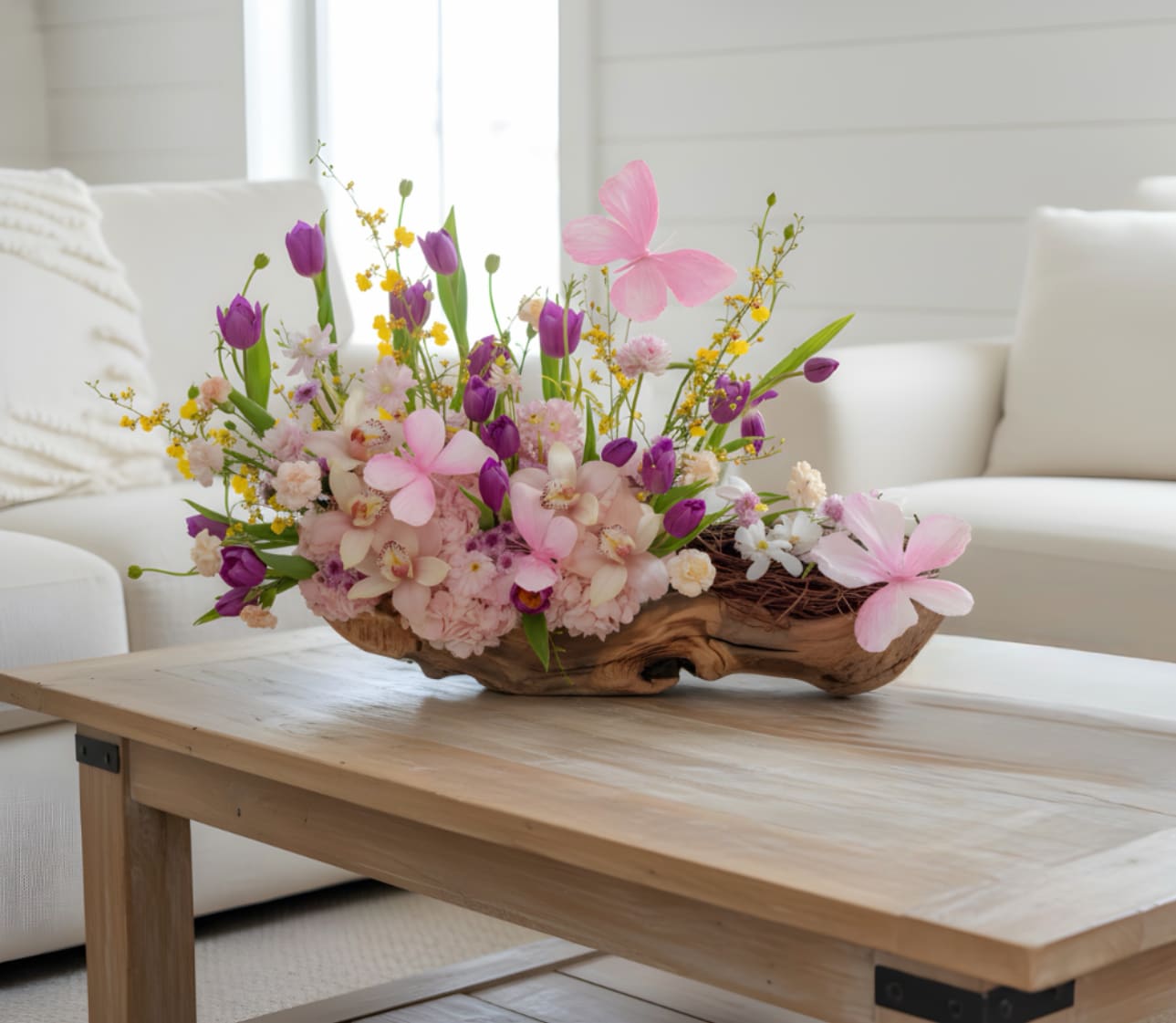 Softness  - Pink hydrangeas, pink orchids and tulips with sunny yellow accents in a low wooden bowl - a soft, garden-style arrangement for birthdays, Mother's Day, spring or just because.