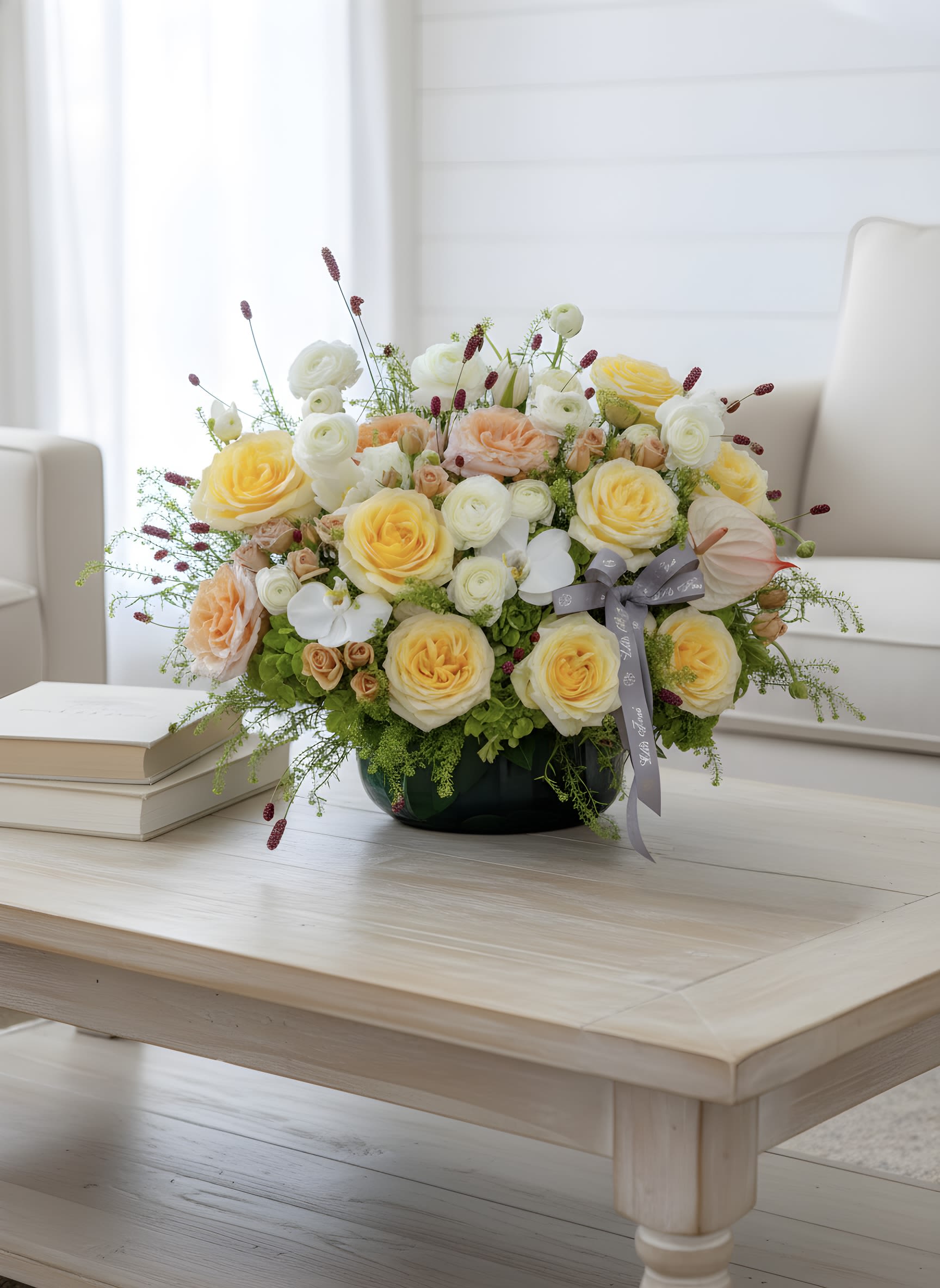 Sunlit Garden  - Soft, springtime romance in a polished, rounded arrangement-perfect as an anniversary bouquet or celebratory gift. Small burgundy accents and airy filler give subtle texture and vertical movement, so the person you're gifting it to will feel truly celebrated. 