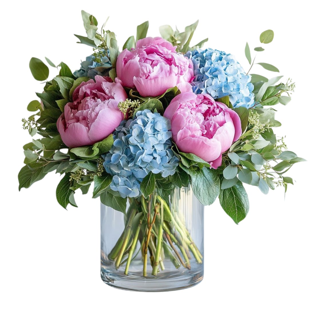 Pink peonies and blue hydrangeas arranged in a clear glass cylinder vase