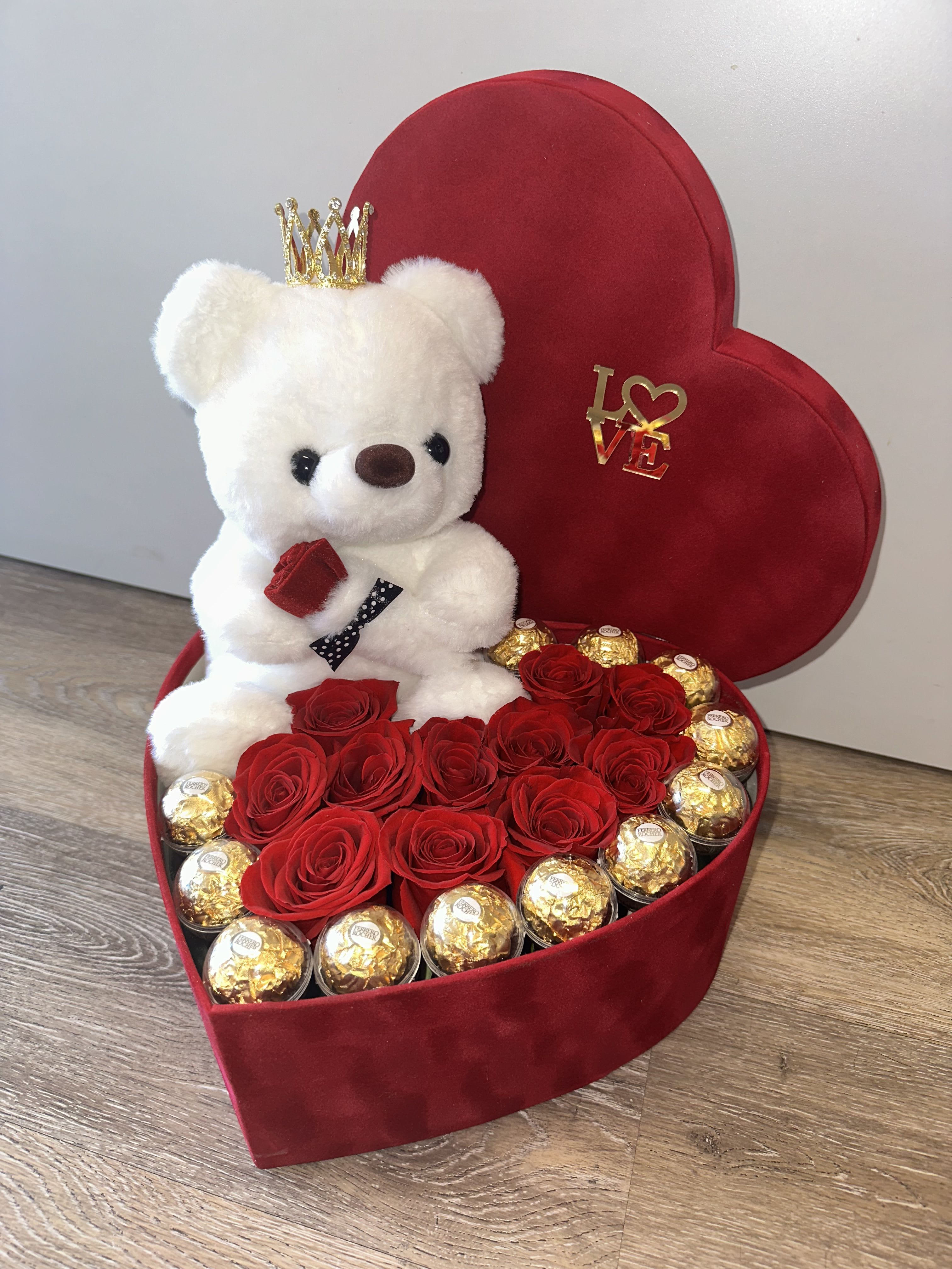 Beautiful velvet box with a teddy bear, Ferrero Rocher chocolates encased in acrylic, and red roses. - Beautiful velvet box with a teddy bear, Ferrero Rocher chocolates encased in acrylic, and red roses.