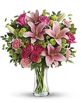 Dressed To Impress Bouquet - What's better than pink? More pink! This blissful bouquet of roses and lilies is arranged and delivered by a local florist in a classic glass vase. This flower arrangement is sure to put some pink in their cheeks and a smile on their faces! What's better than pink? More pink! This blissful bouquet of roses and lilies is arranged and delivered by a local florist in a classic glass vase. This flower arrangement is sure to put some pink in their cheeks and a smile on their faces! Orientation: One-Sided