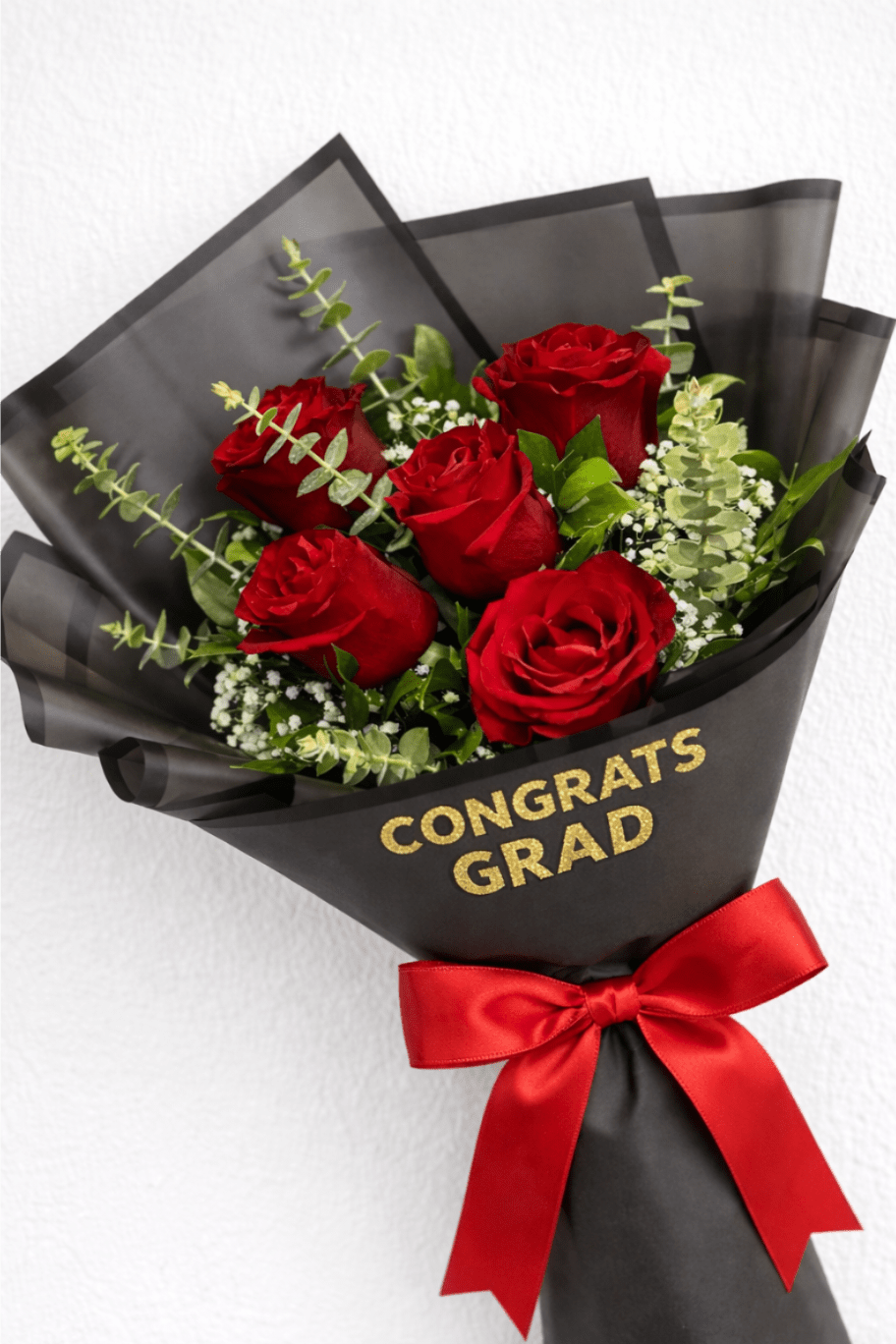 Classic Red Rose Graduation Bouquet - Make their graduation moment unforgettable with this timeless and sophisticated Red Rose Bouquet. Featuring rich, velvety red roses accented with delicate baby’s breath and fresh greenery, this arrangement symbolizes love, pride, and achievement.  Wrapped in sleek black paper with gold “Congrats Grad” lettering, this bouquet delivers a bold and modern presentation that stands out in any celebration. Perfectly balanced between classic romance and celebratory style, it’s an ideal gift to honor their hard work and success.   Perfect for:  Graduation ceremonies Romantic graduation gifts Photo-worthy moments Celebrating a proud milestone  Simple, elegant, and meaningful—this bouquet says “I’m proud of you” in the most beautiful way ️
