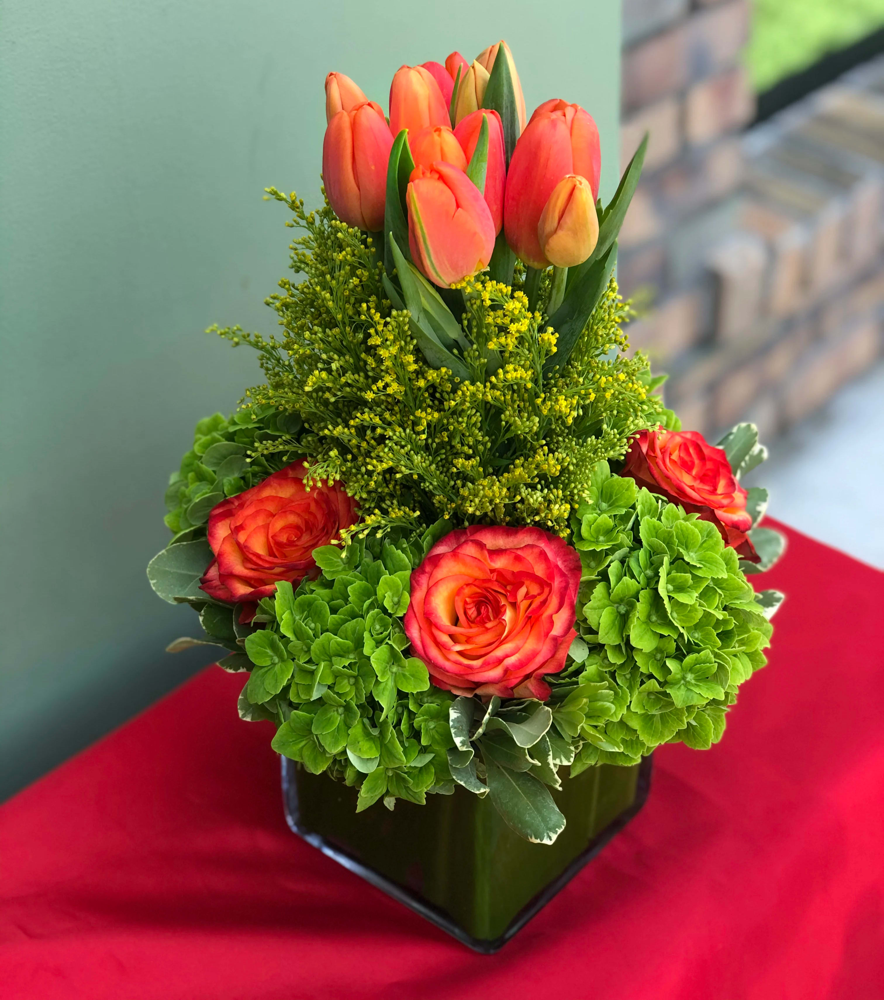Roses and Tulips Arrangement - A low vase holding Roses, Hydrangeas and Tulips. 7" wide, 12" high.