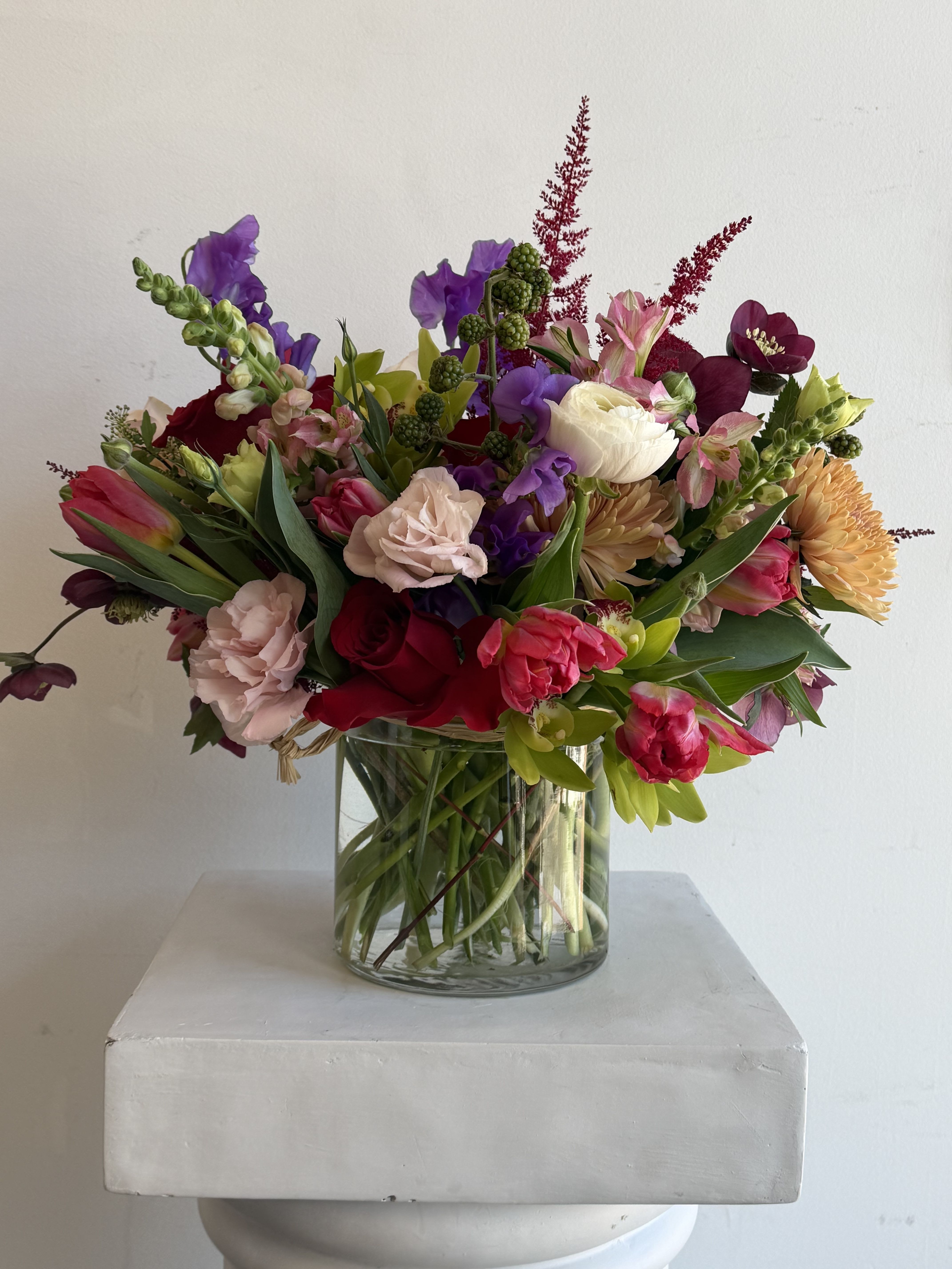 Colorful mixed bouquet in a clear glass vase
