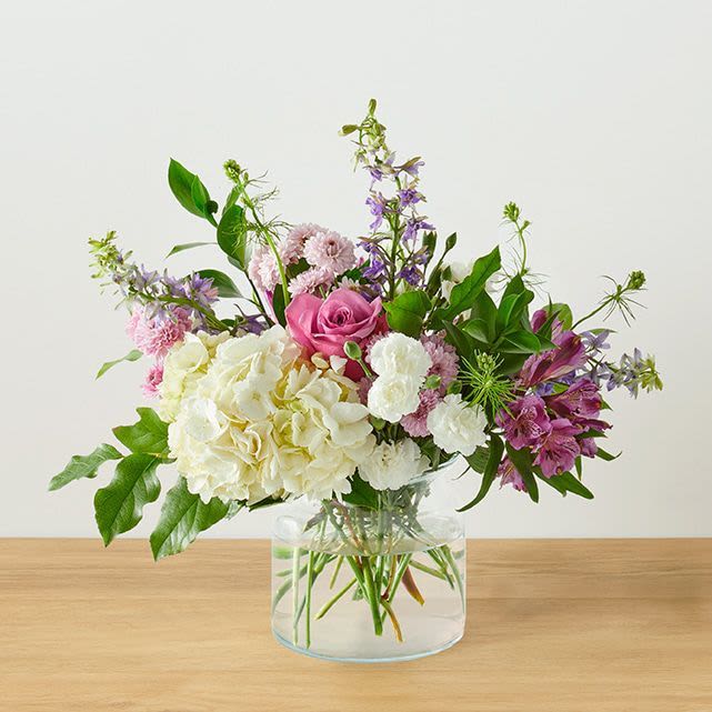 Lavender Yard Arrangement - This charming arrangement trades formal symmetry for a soft, just-picked-from-the-meadow feel, and is a whimsical blend of classic garden blooms and airy textures.